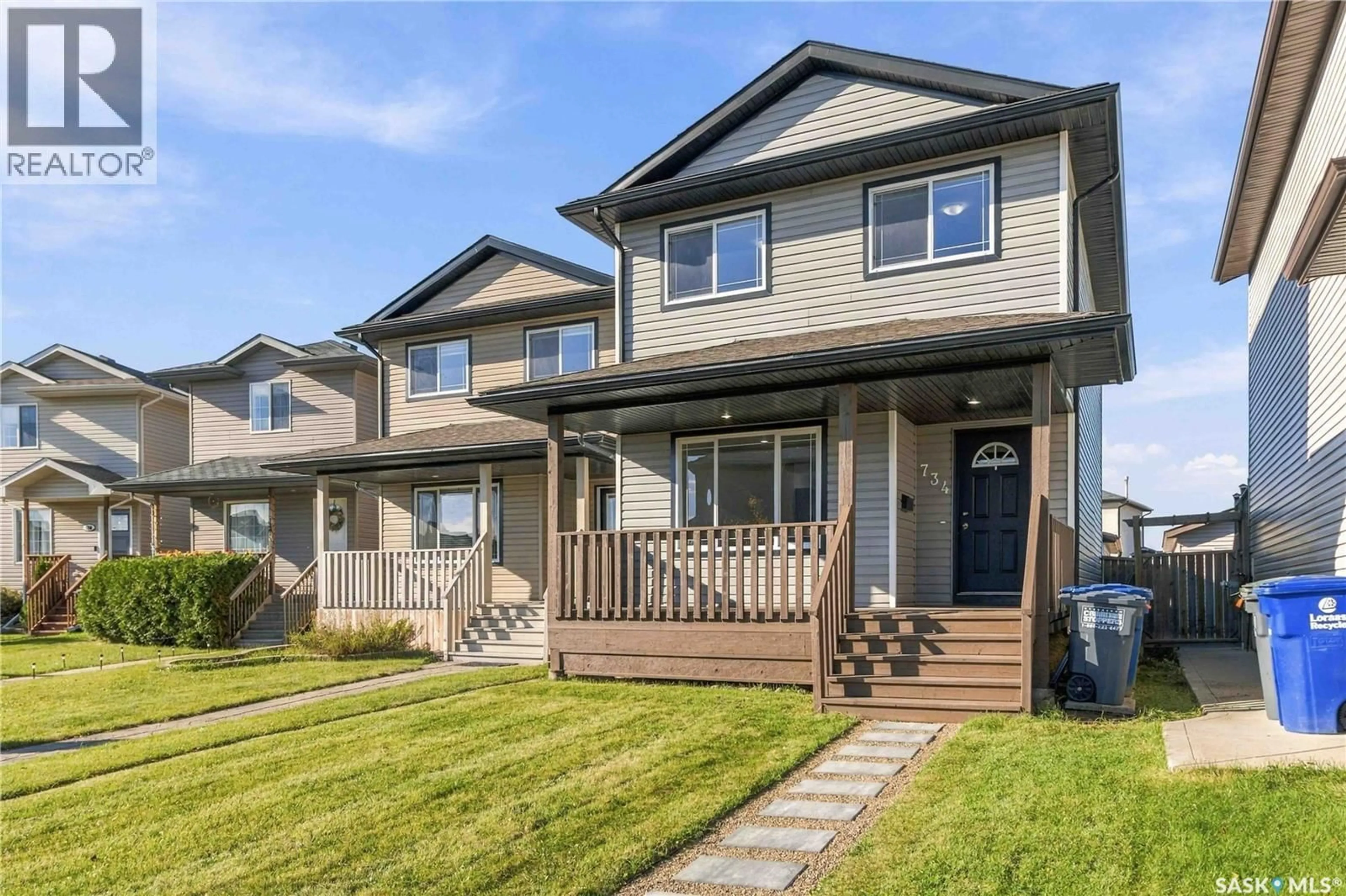 Home with vinyl exterior material, street for 734 LAMARSH LANE, Saskatoon Saskatchewan S0K4S3