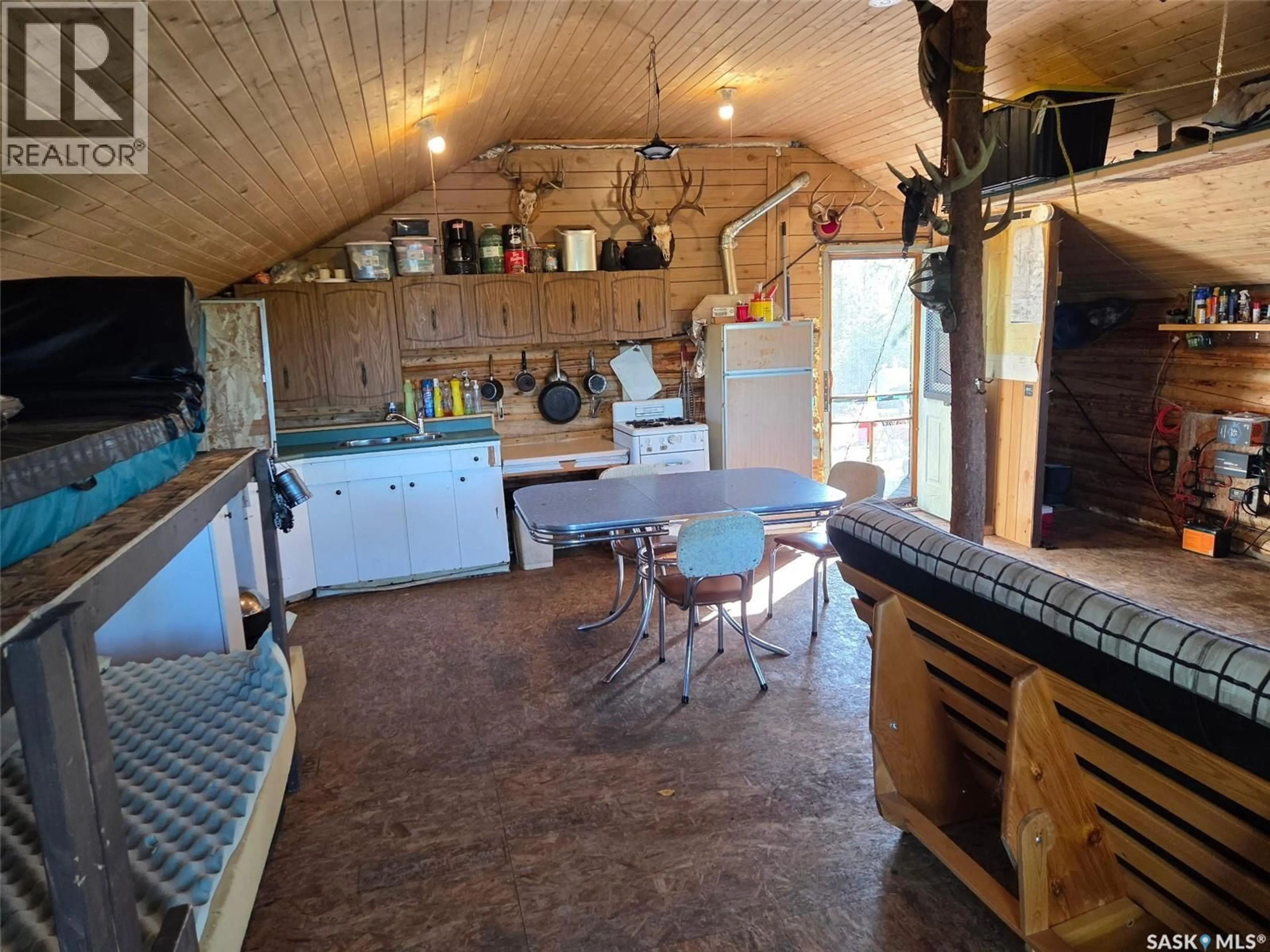 Rustic kitchen, unknown for LOG CABIN, Northern Admin District Saskatchewan S0J1L0