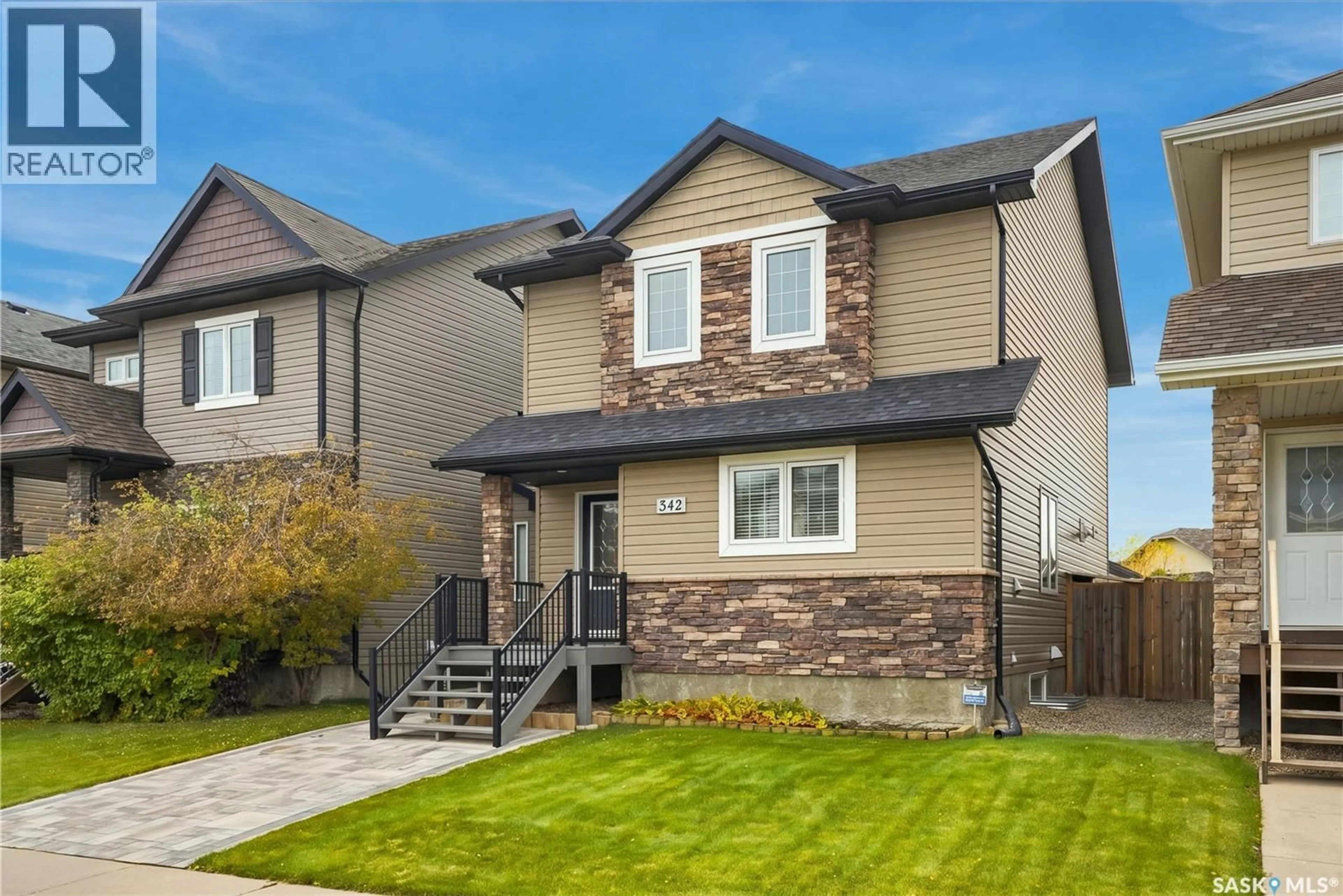 Home with vinyl exterior material, street for 342 LYND LANE, Saskatoon Saskatchewan S7T0B1