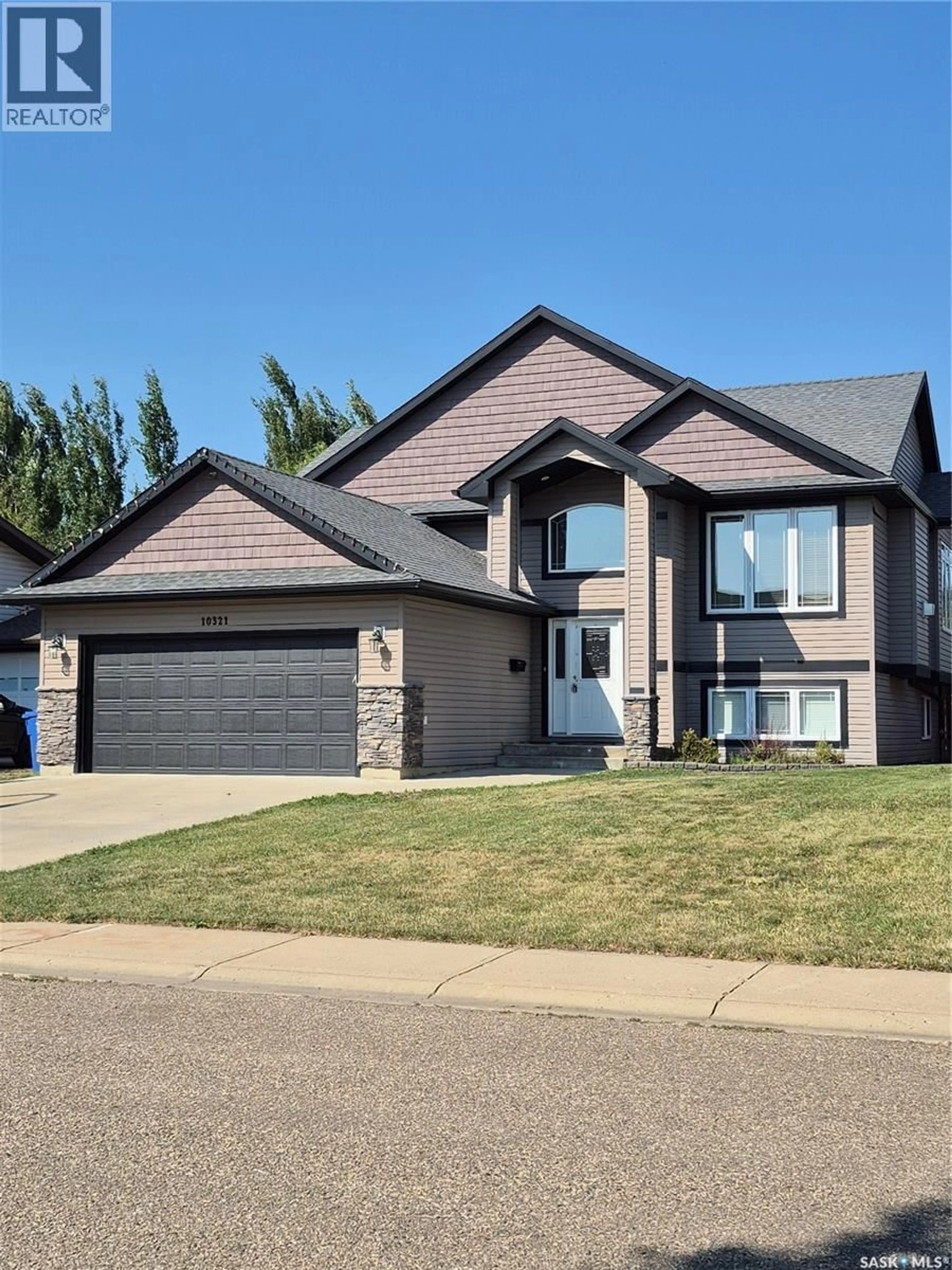 Home with vinyl exterior material, street for 10321 HENDERSON DRIVE, North Battleford Saskatchewan S9Z3Y9