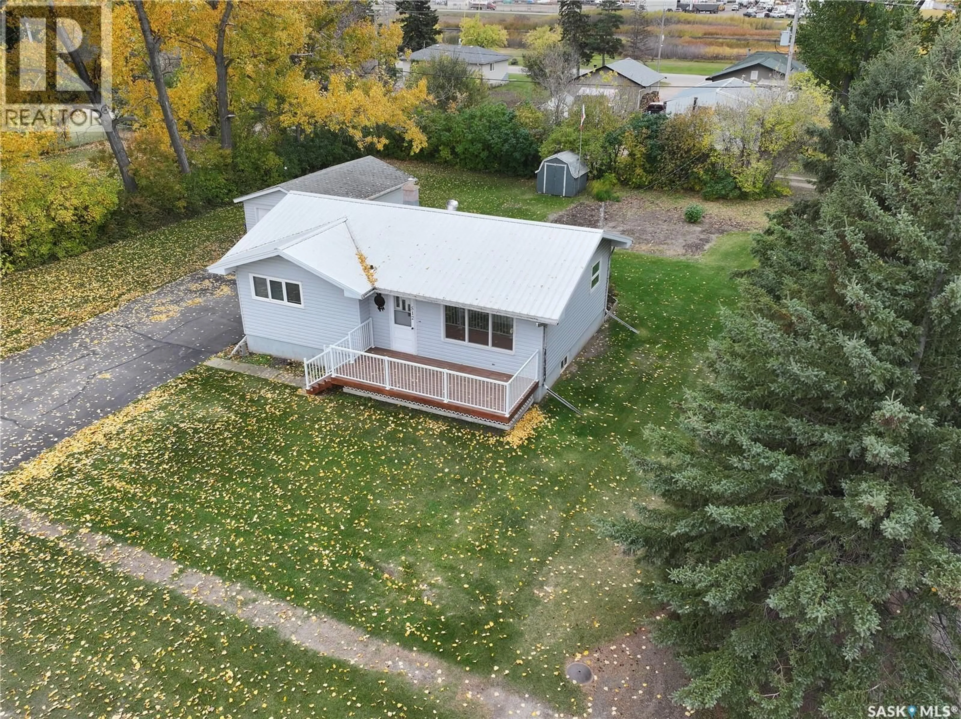 A pic from outside/outdoor area/front of a property/back of a property/a pic from drone, street for 512 2ND AVENUE, Raymore Saskatchewan S0A3J0