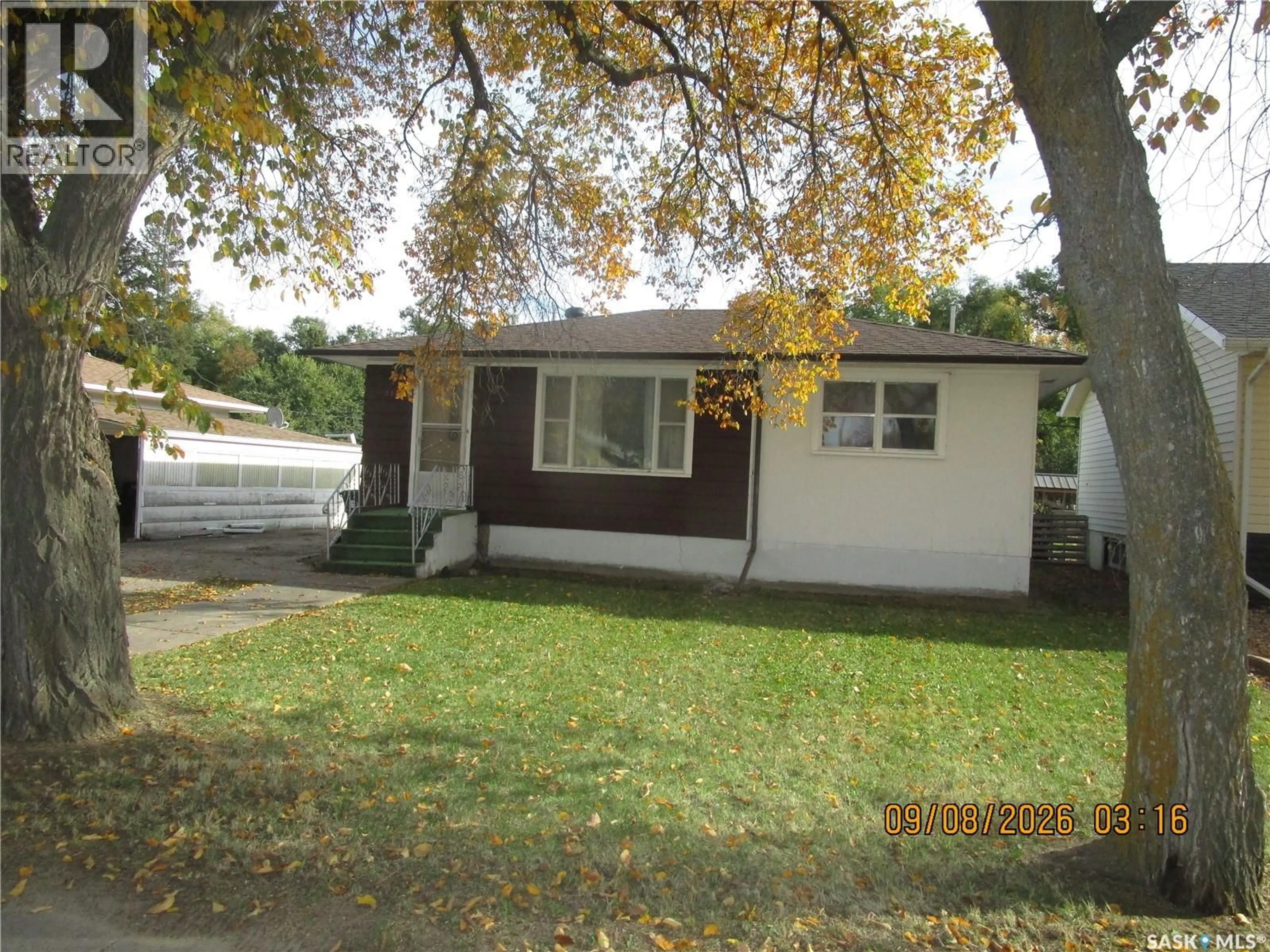 Home with vinyl exterior material, street for 215 DOMINION ROAD, Assiniboia Saskatchewan S0H0B0