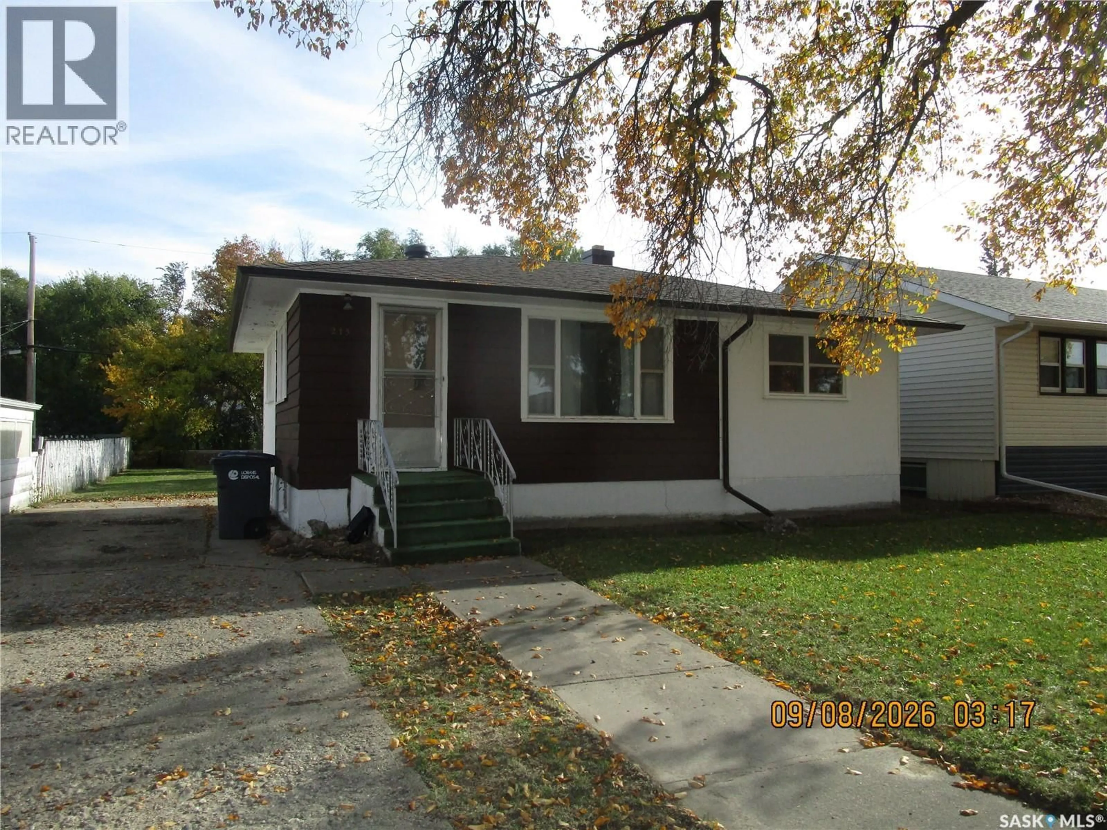 Home with vinyl exterior material, street for 215 DOMINION ROAD, Assiniboia Saskatchewan S0H0B0