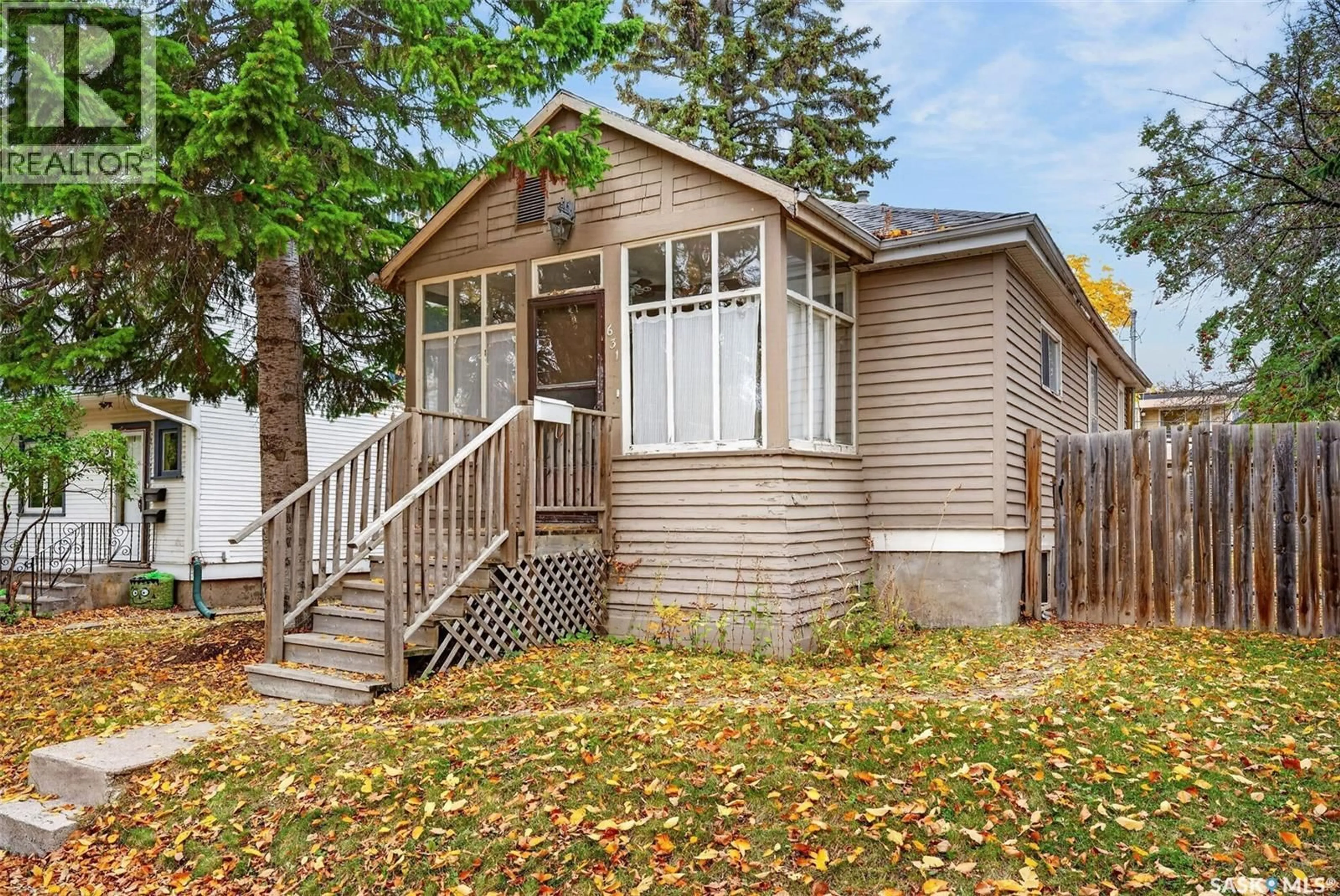 Home with vinyl exterior material, street for 631 7TH STREET, Saskatoon Saskatchewan S7X0X8