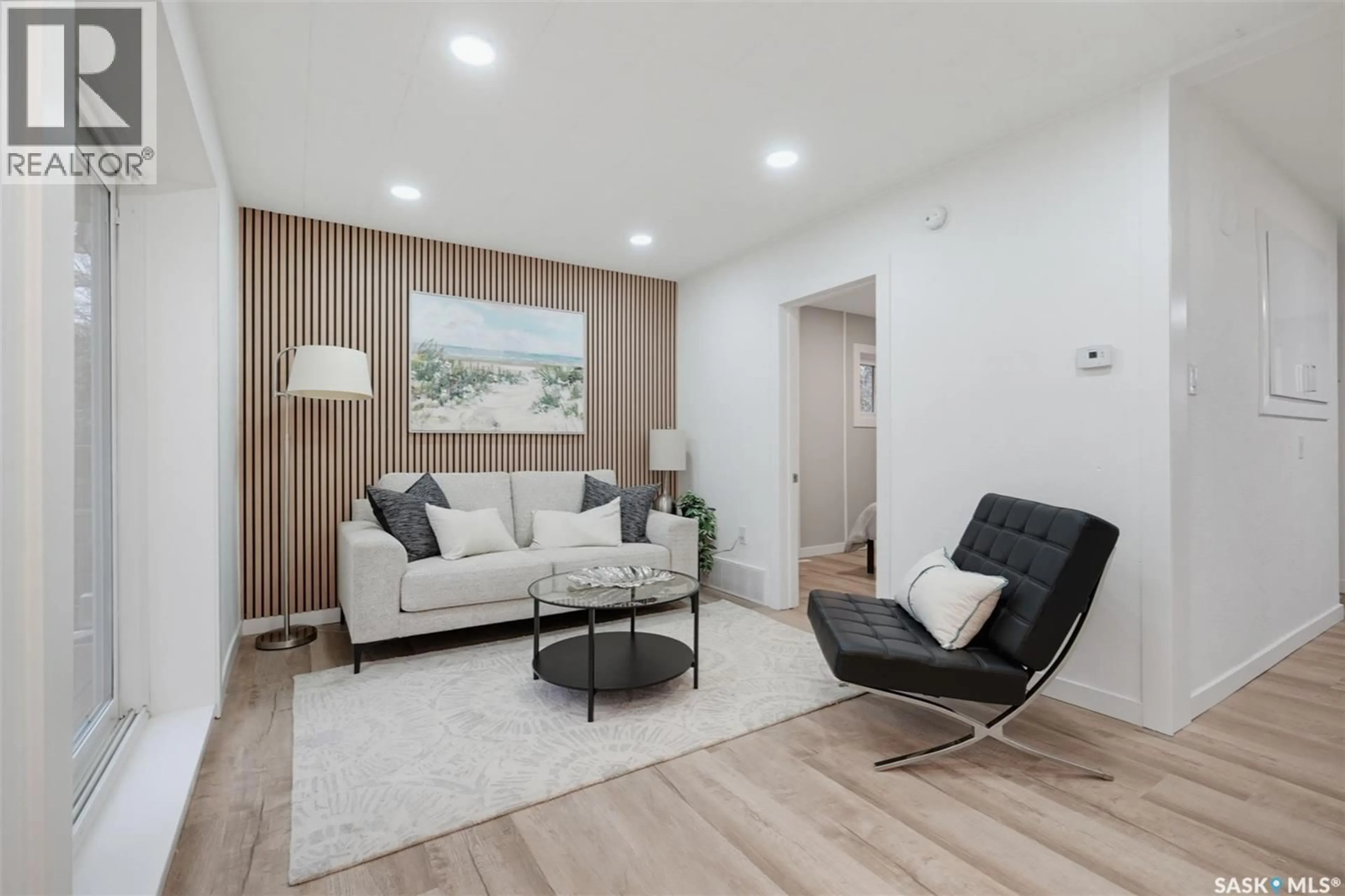 Living room with furniture, wood/laminate floor for 1228 1ST AVENUE, Saskatoon Saskatchewan S7K1Y6