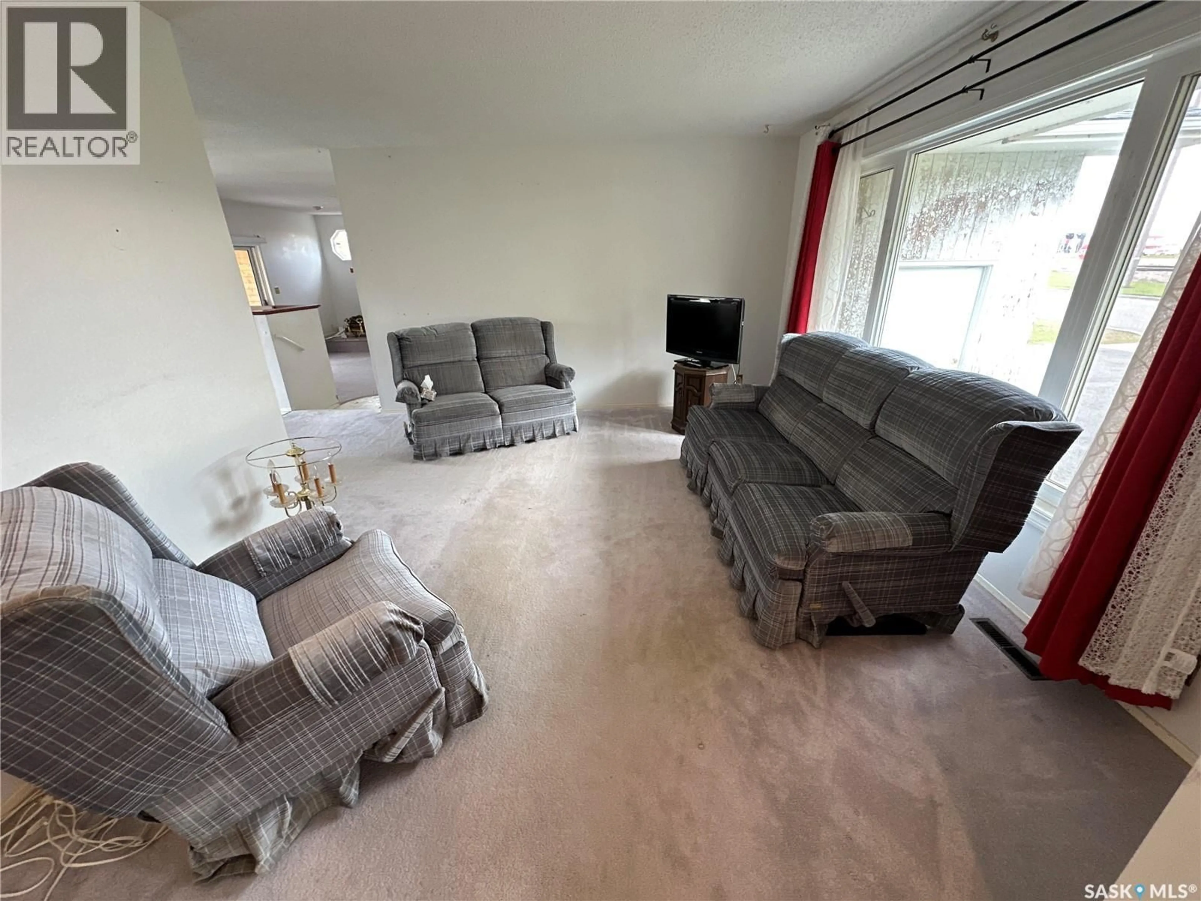 Living room with furniture, unknown for 110 RAILWAY AVENUE, Rosthern Saskatchewan S0K3R0