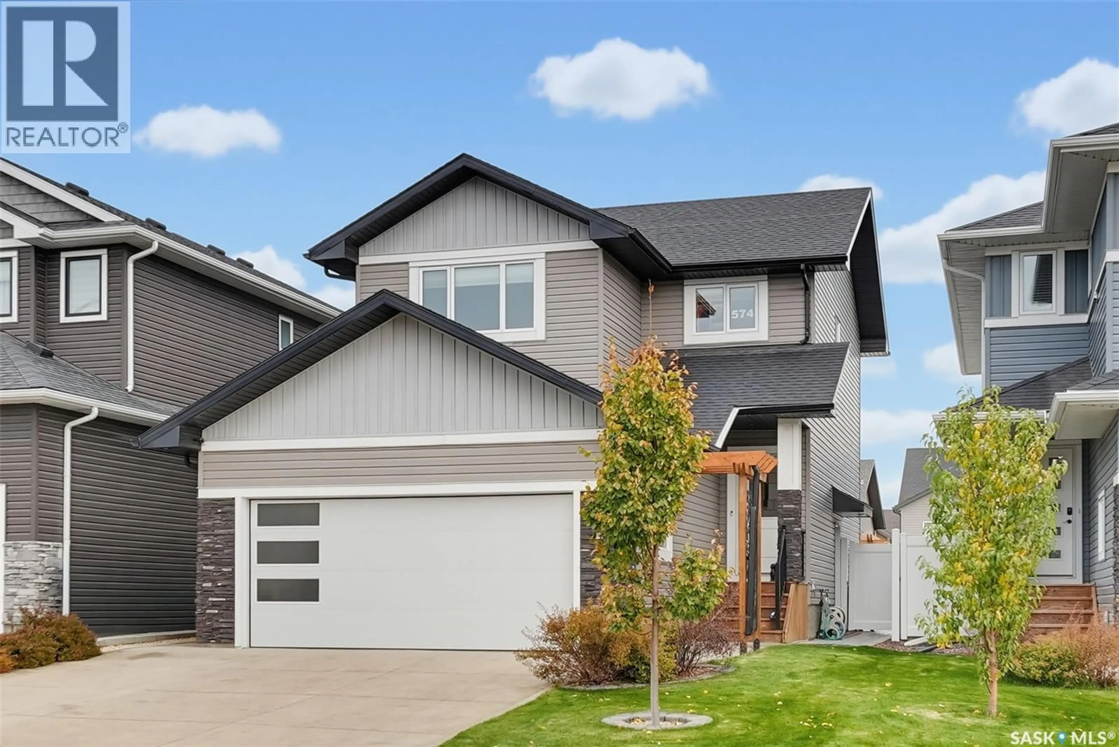 Home with vinyl exterior material, street for 574 MCFAULL CRESCENT, Saskatoon Saskatchewan S7V0T3