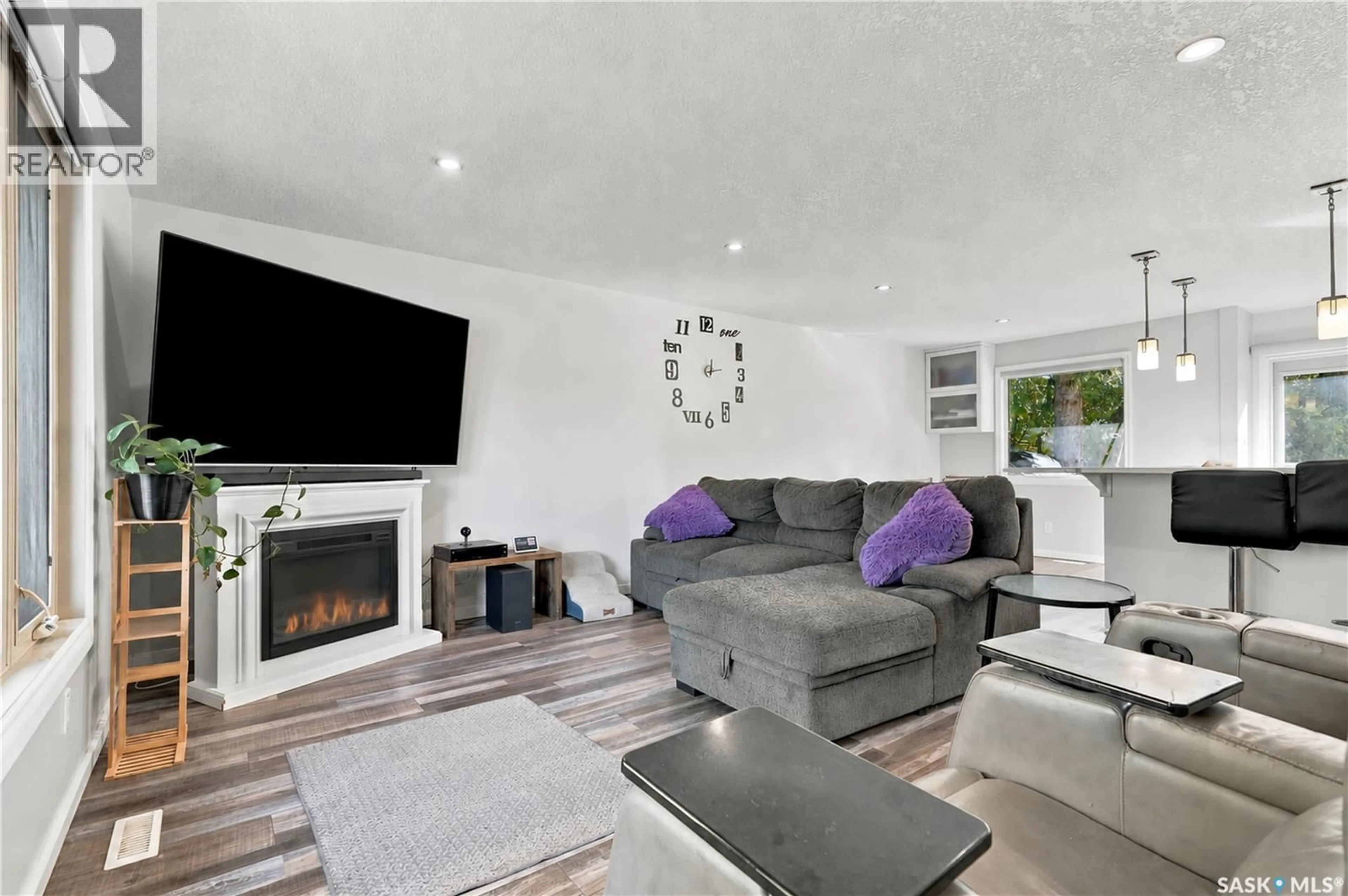 Living room with furniture, wood/laminate floor for 538 HIGHLANDS TERRACE, Saskatoon Saskatchewan S7H4Y6