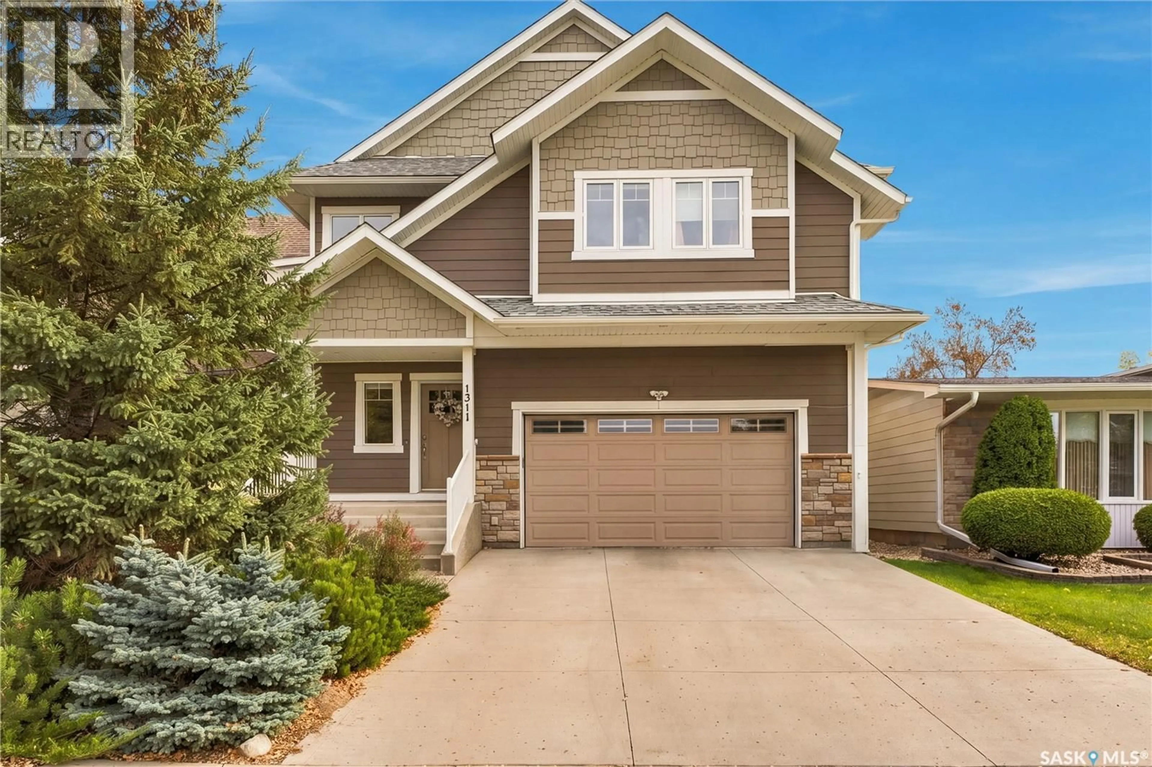 Home with vinyl exterior material, street for 1311 JACKSON AVENUE, Saskatoon Saskatchewan S7H2M9