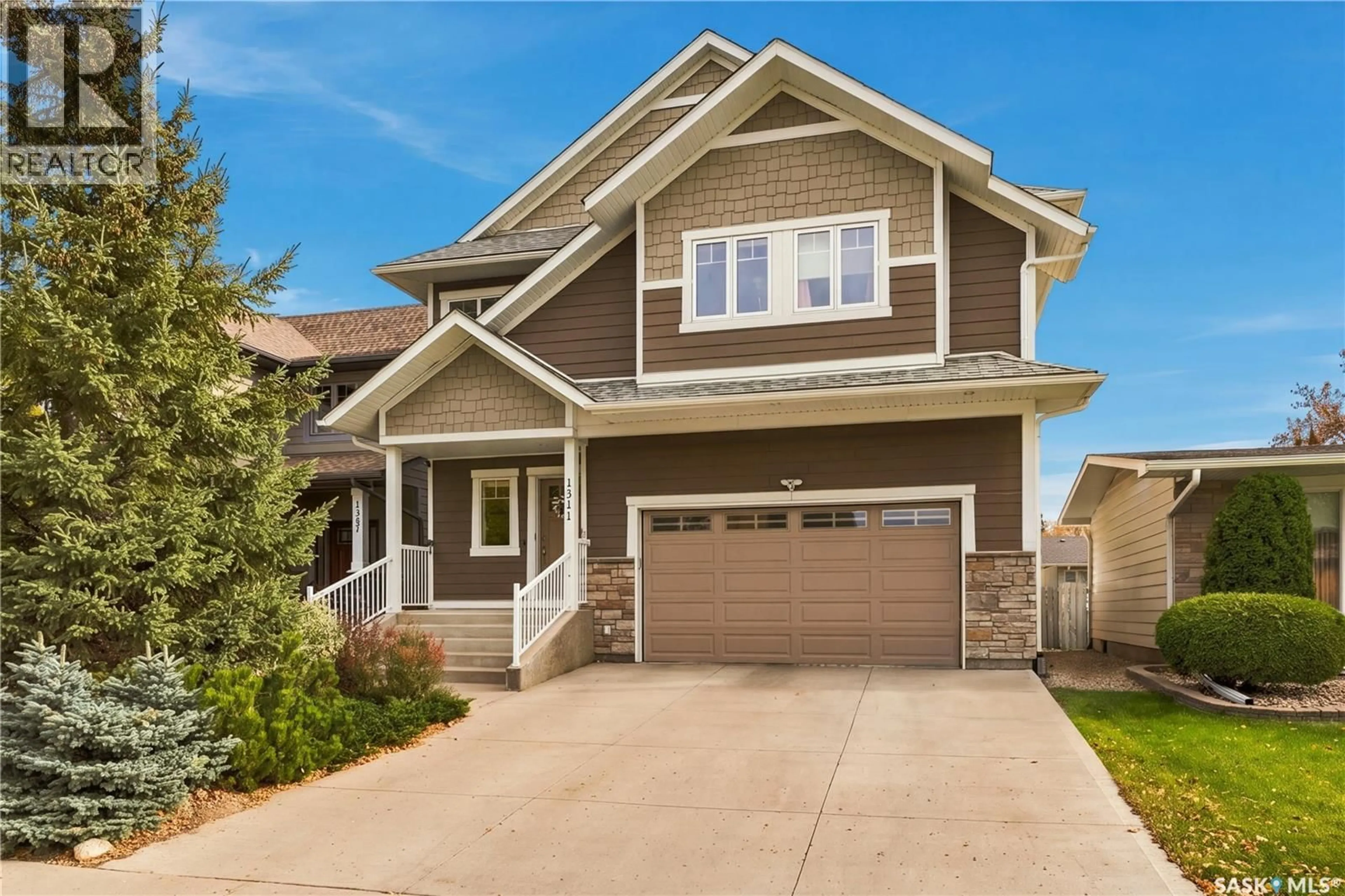 Home with vinyl exterior material, street for 1311 JACKSON AVENUE, Saskatoon Saskatchewan S7H2M9