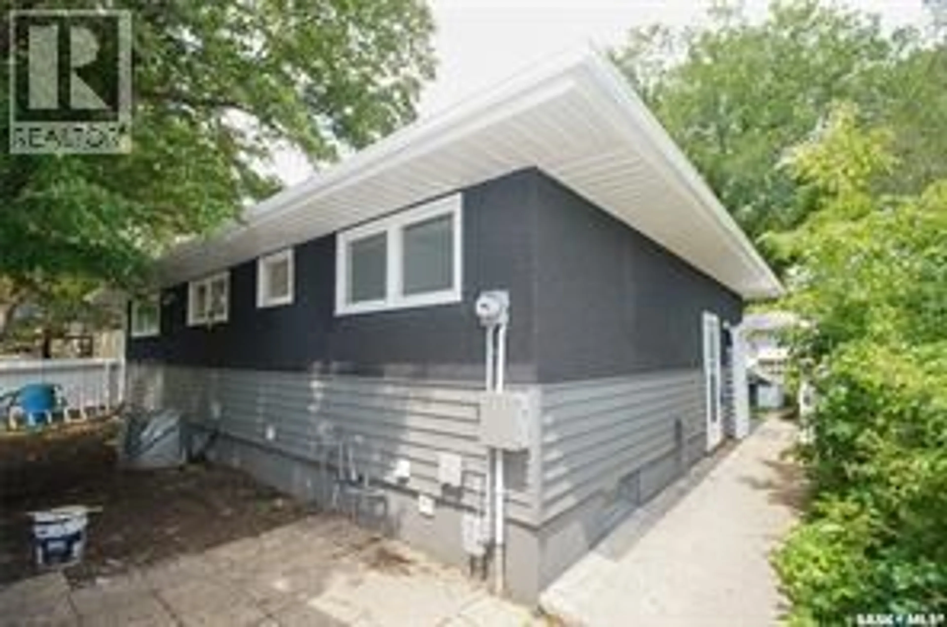 Home with vinyl exterior material, street for 61 BANNISTER AVENUE, Regina Saskatchewan S4R5K8