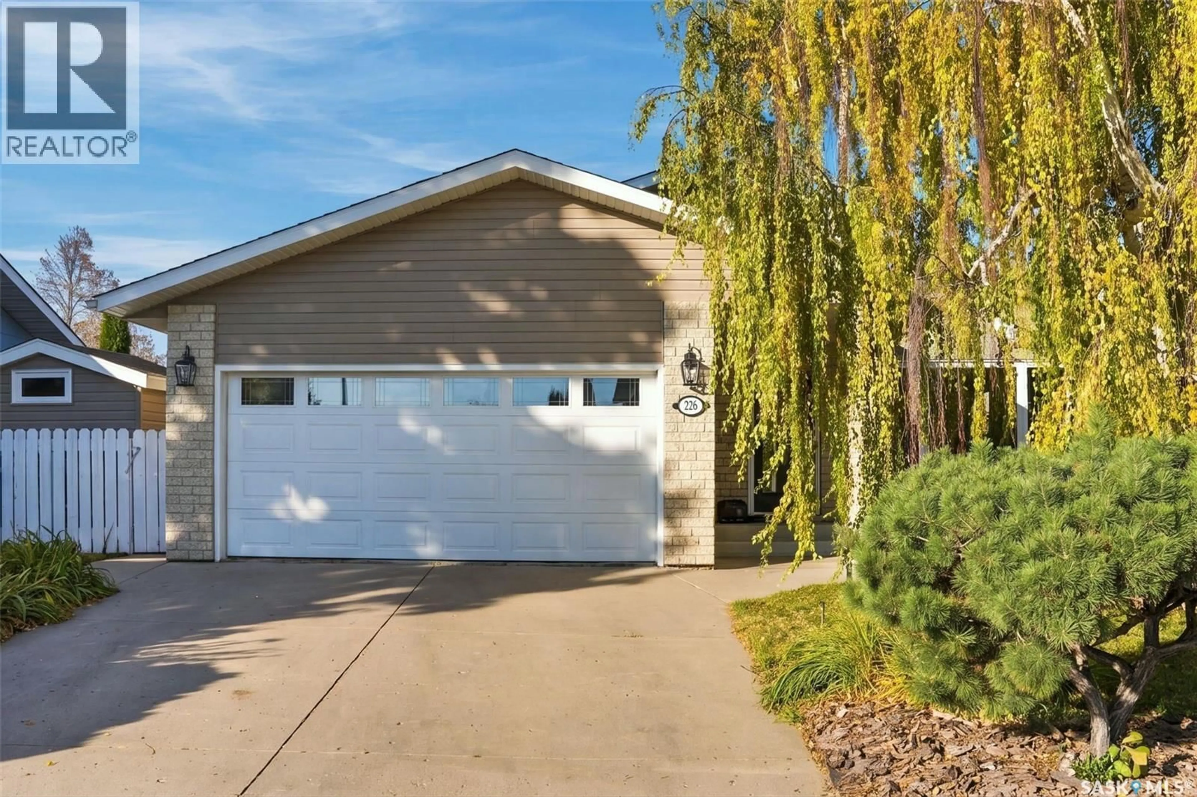 Home with vinyl exterior material, street for 226 GUSTIN PLACE, Saskatoon Saskatchewan S7K6G6