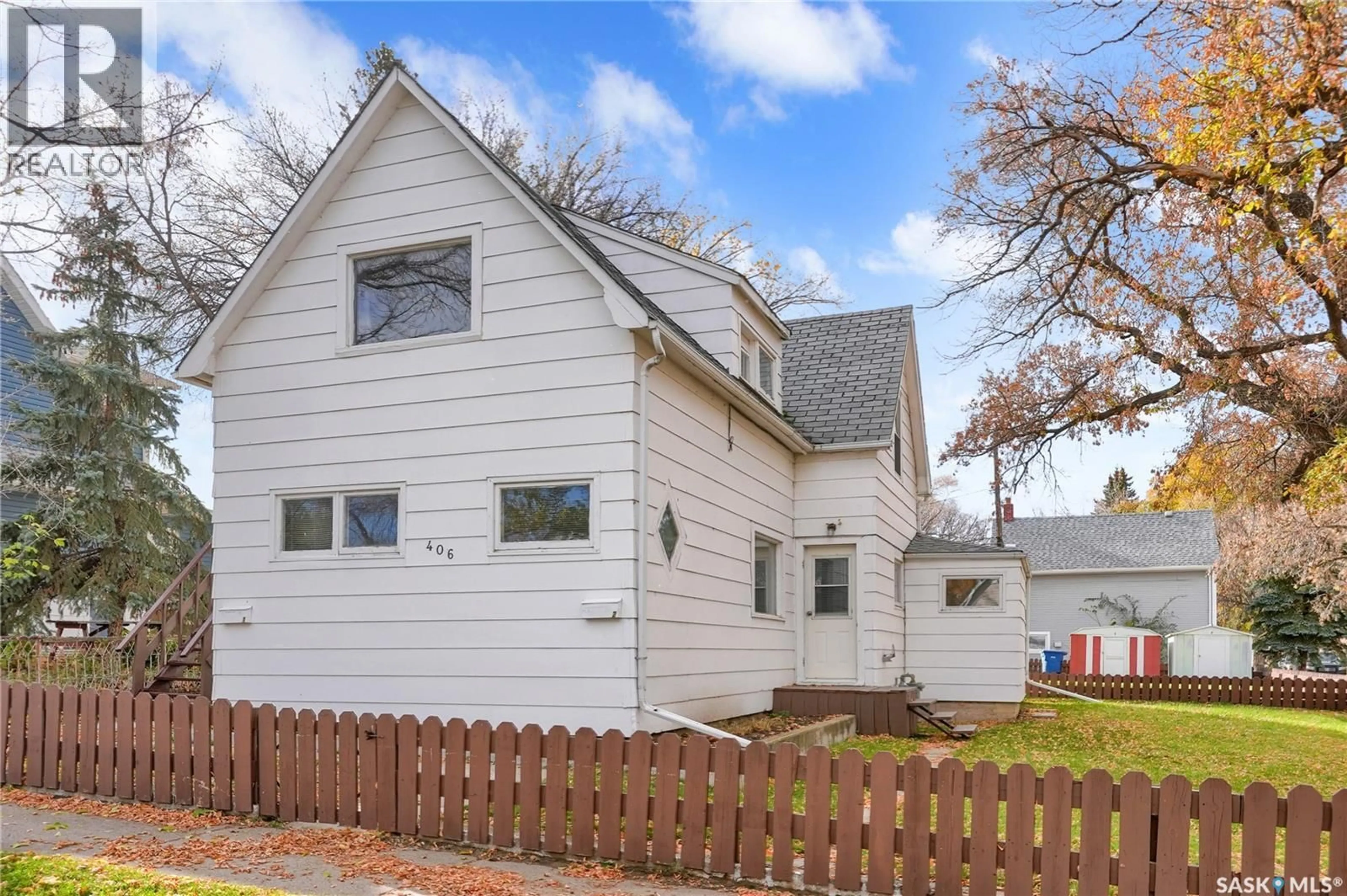 Home with vinyl exterior material, street for 406 MAIN STREET, Moose Jaw Saskatchewan S6H5S9