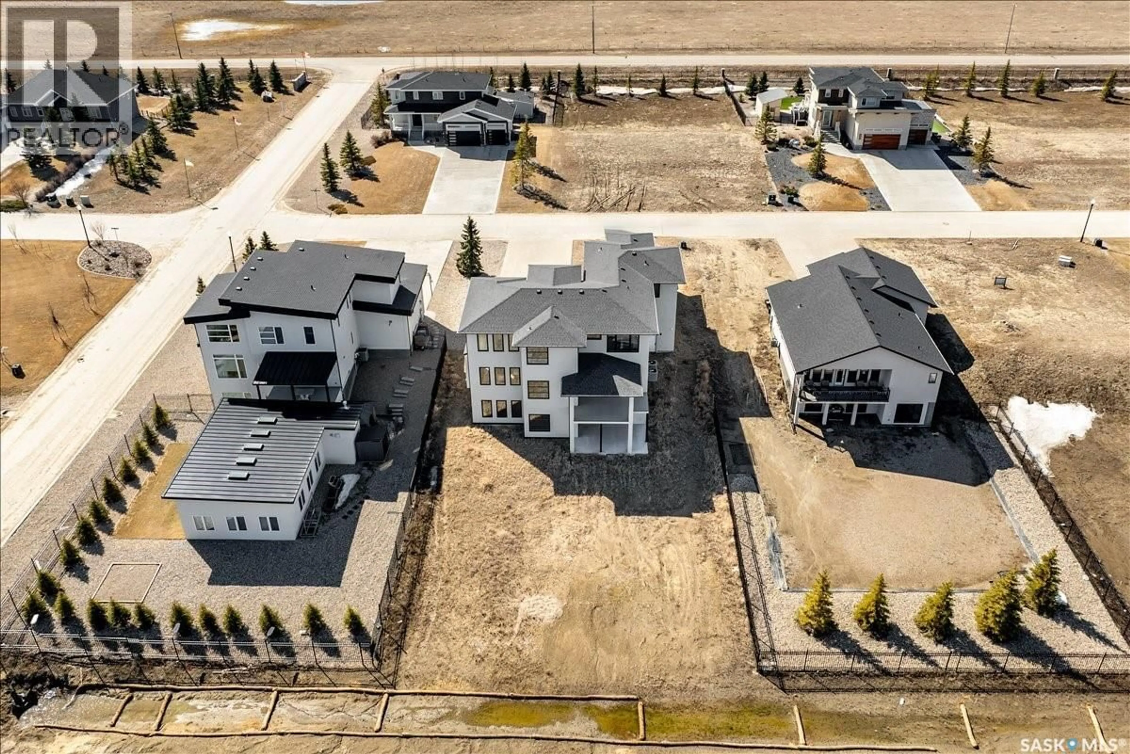 A pic from outside/outdoor area/front of a property/back of a property/a pic from drone, unknown for 304 SPRUCE CREEK CRESCENT, Edenwold Rm No.158 Saskatchewan S0G3Z0