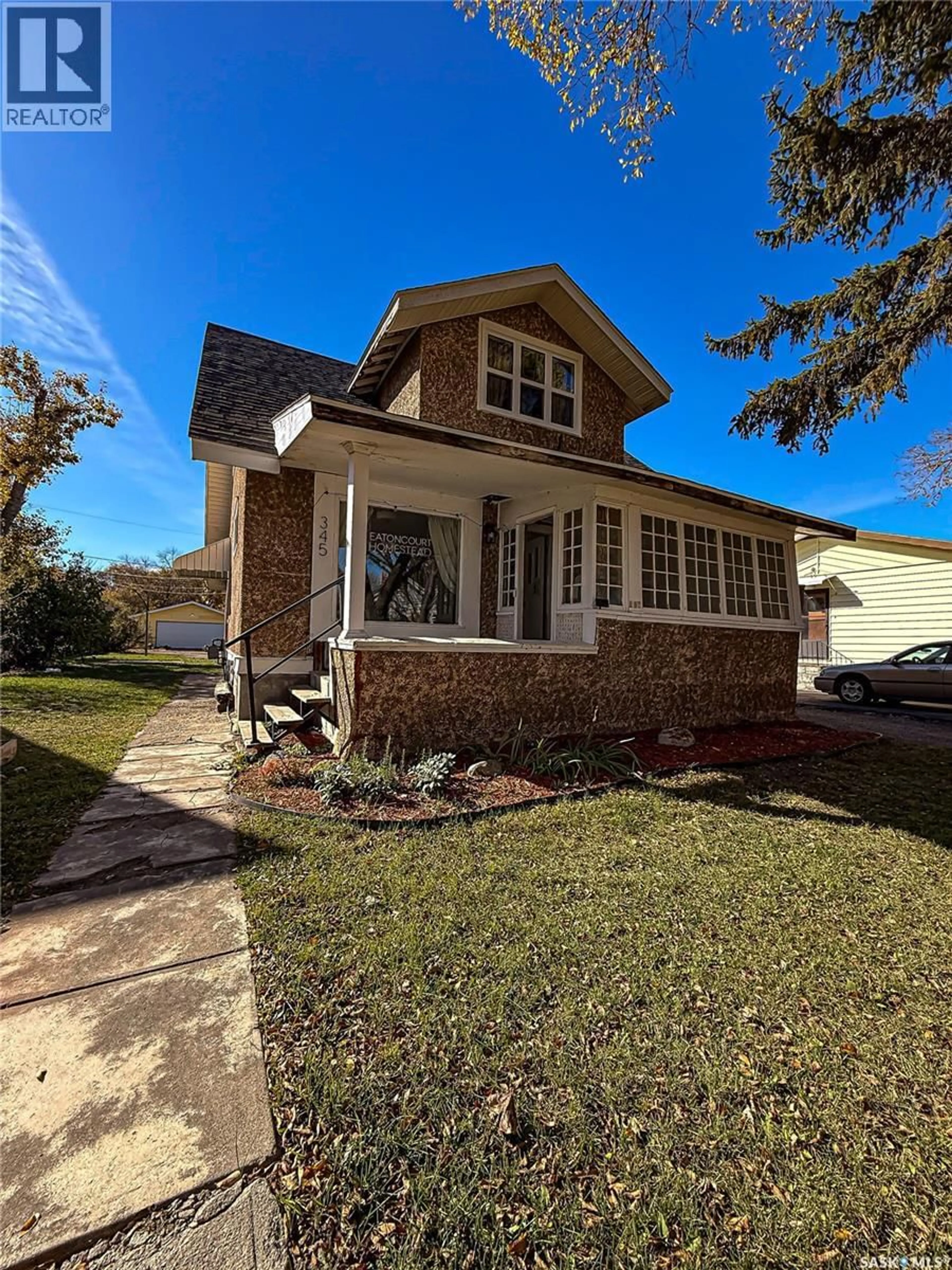 Home with brick exterior material, street for 345 2ND STREET, Shaunavon Saskatchewan S0N2M0