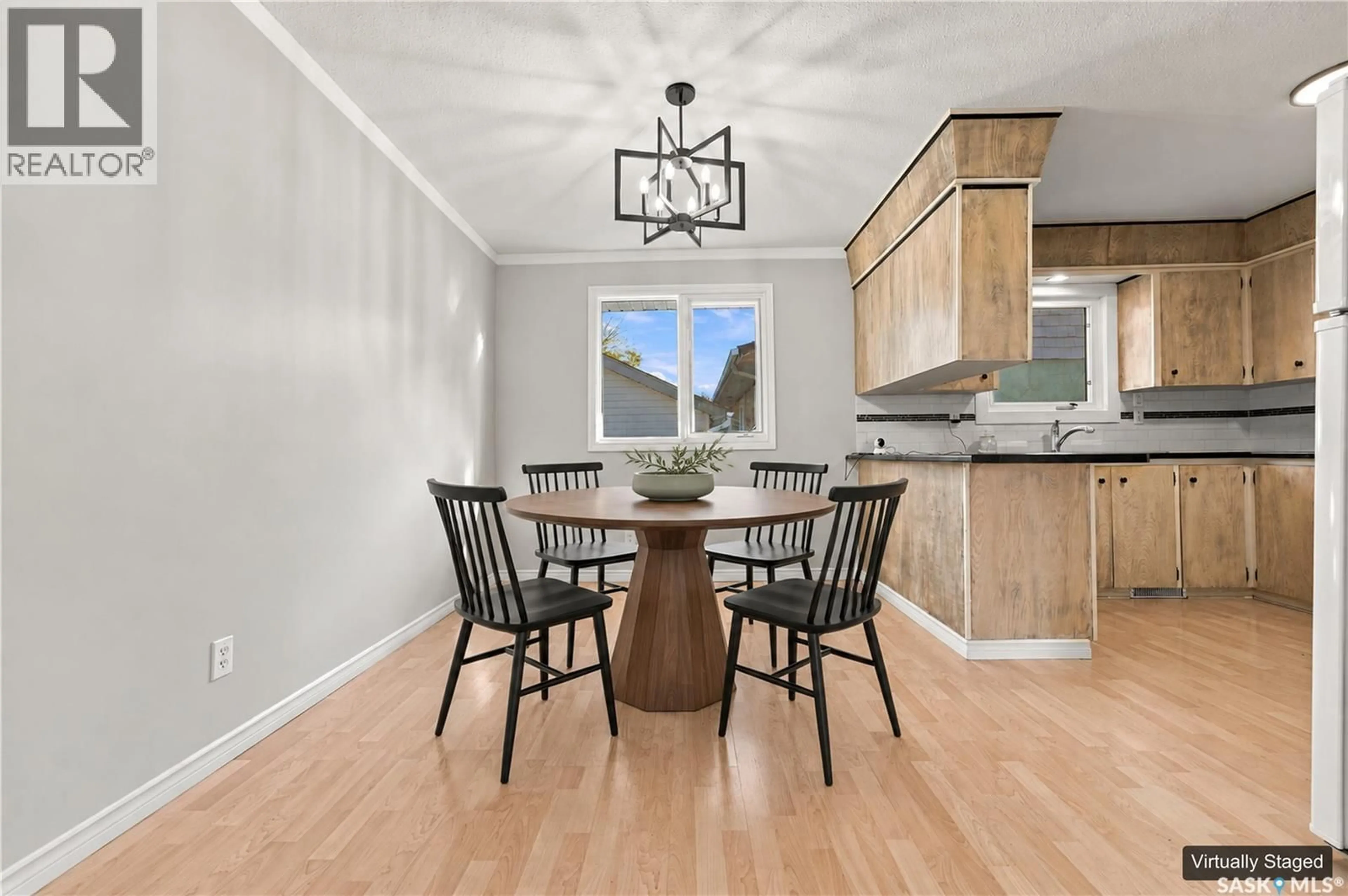 Open concept kitchen, wood/laminate floor for 3538 CENTENNIAL DRIVE, Saskatoon Saskatchewan S7L5C2