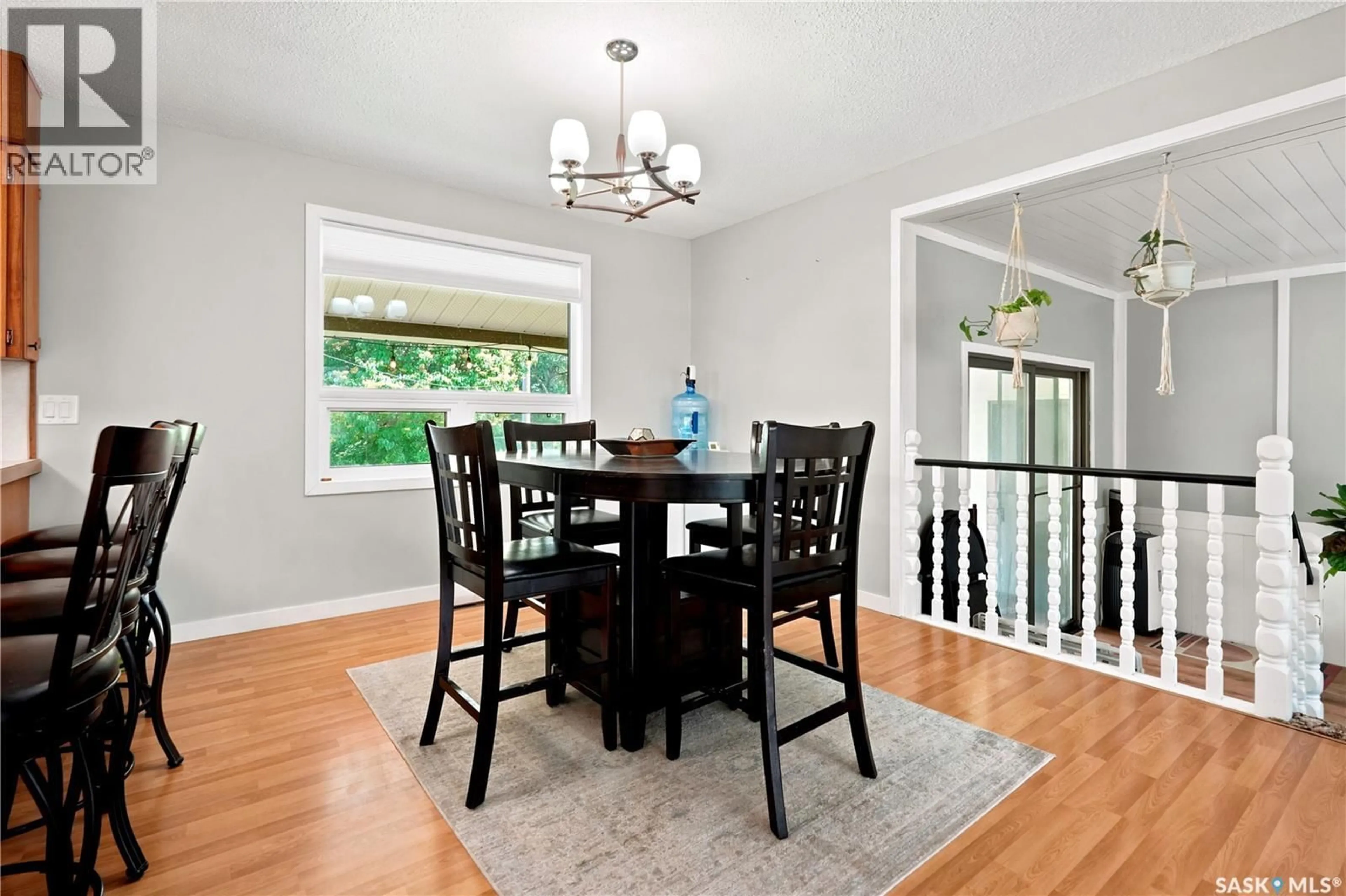 Dining room, wood/laminate floor for 133 POLLARD STREET, Earl Grey Saskatchewan S0G1J0