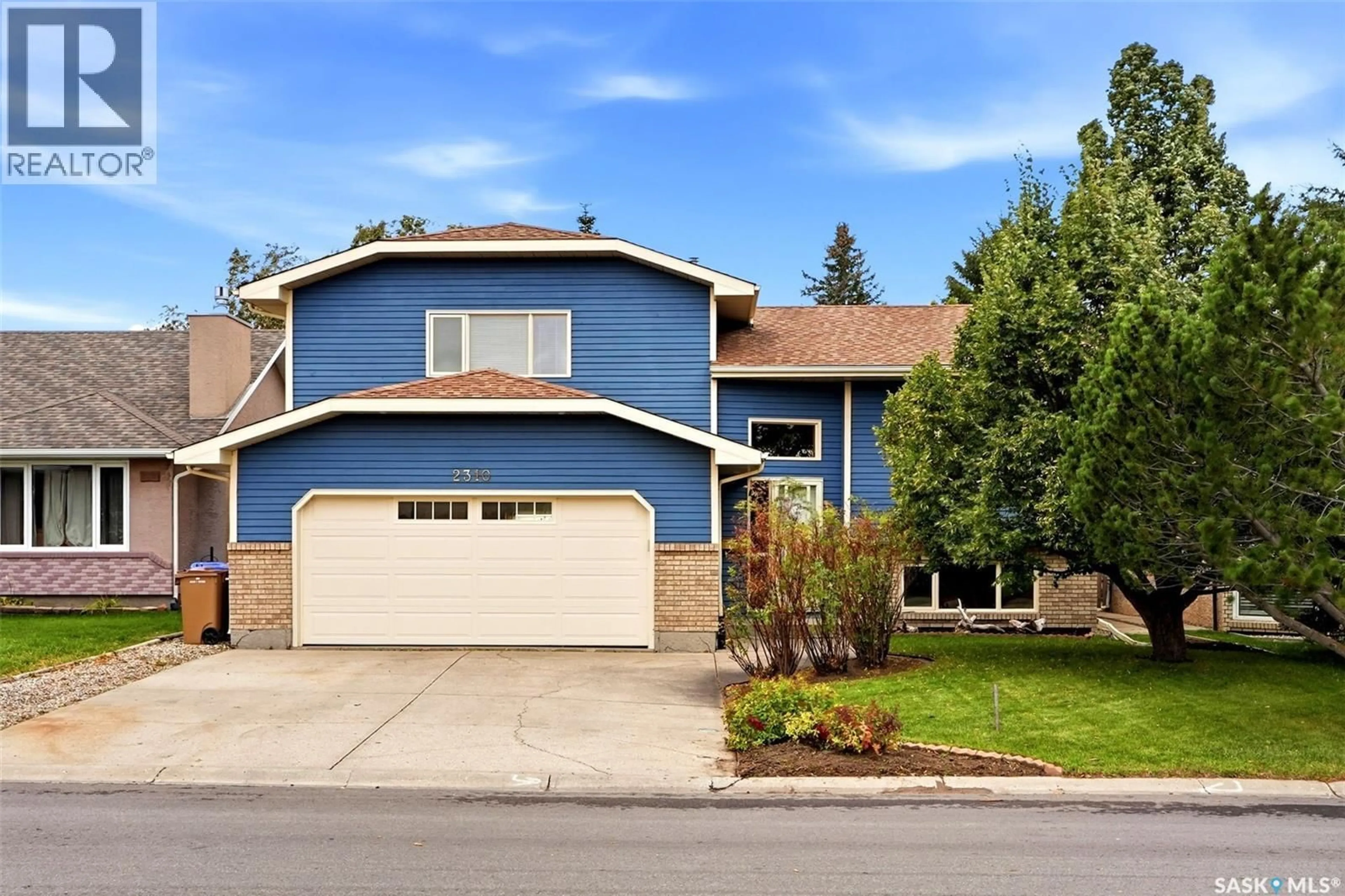 Home with vinyl exterior material, street for 2310 MCLURG CRESCENT, Regina Saskatchewan S4V2N5