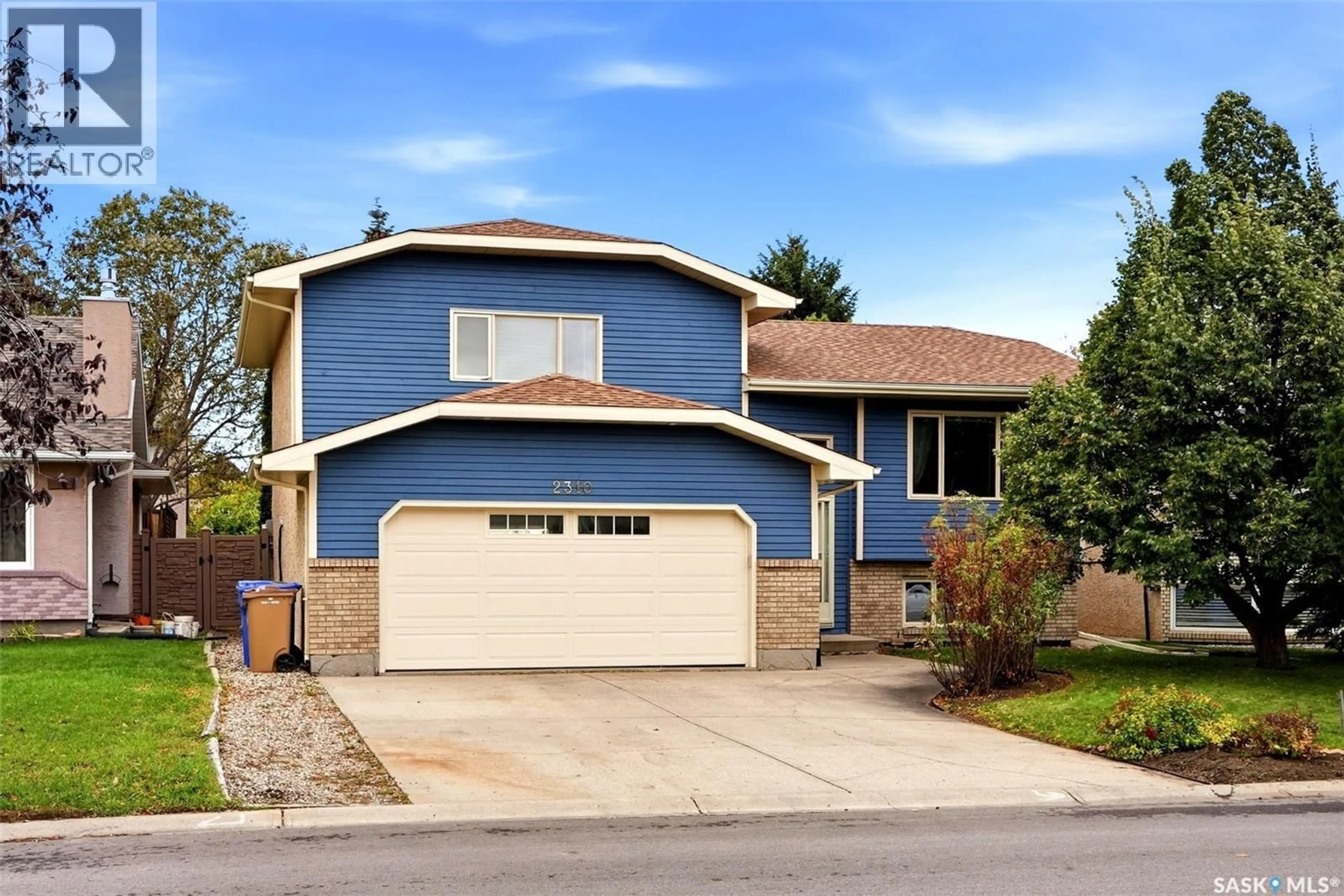 Home with vinyl exterior material, street for 2310 MCLURG CRESCENT, Regina Saskatchewan S4V2N5