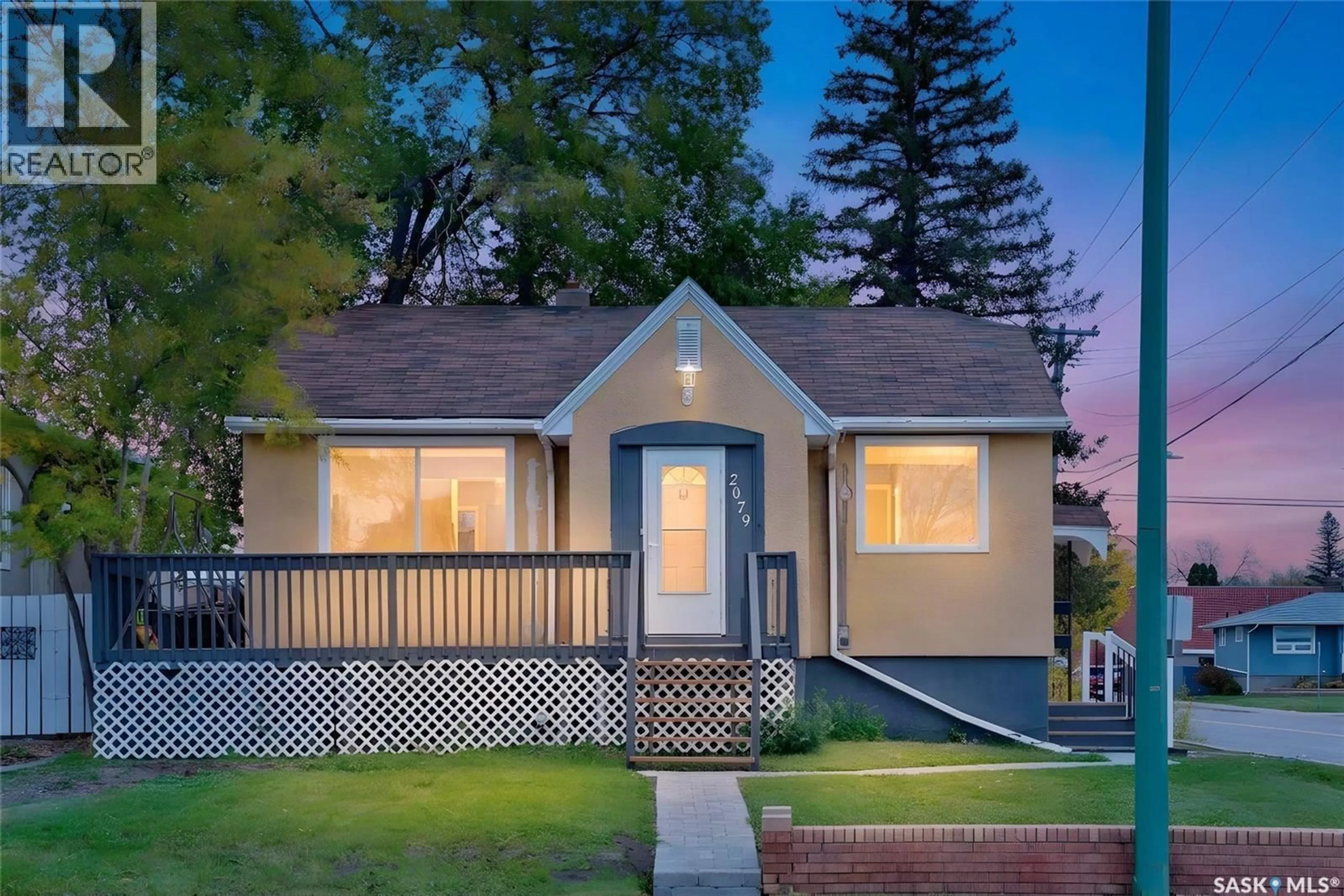 Home with vinyl exterior material, street for 2079 PASQUA STREET, Regina Saskatchewan S4T4M1
