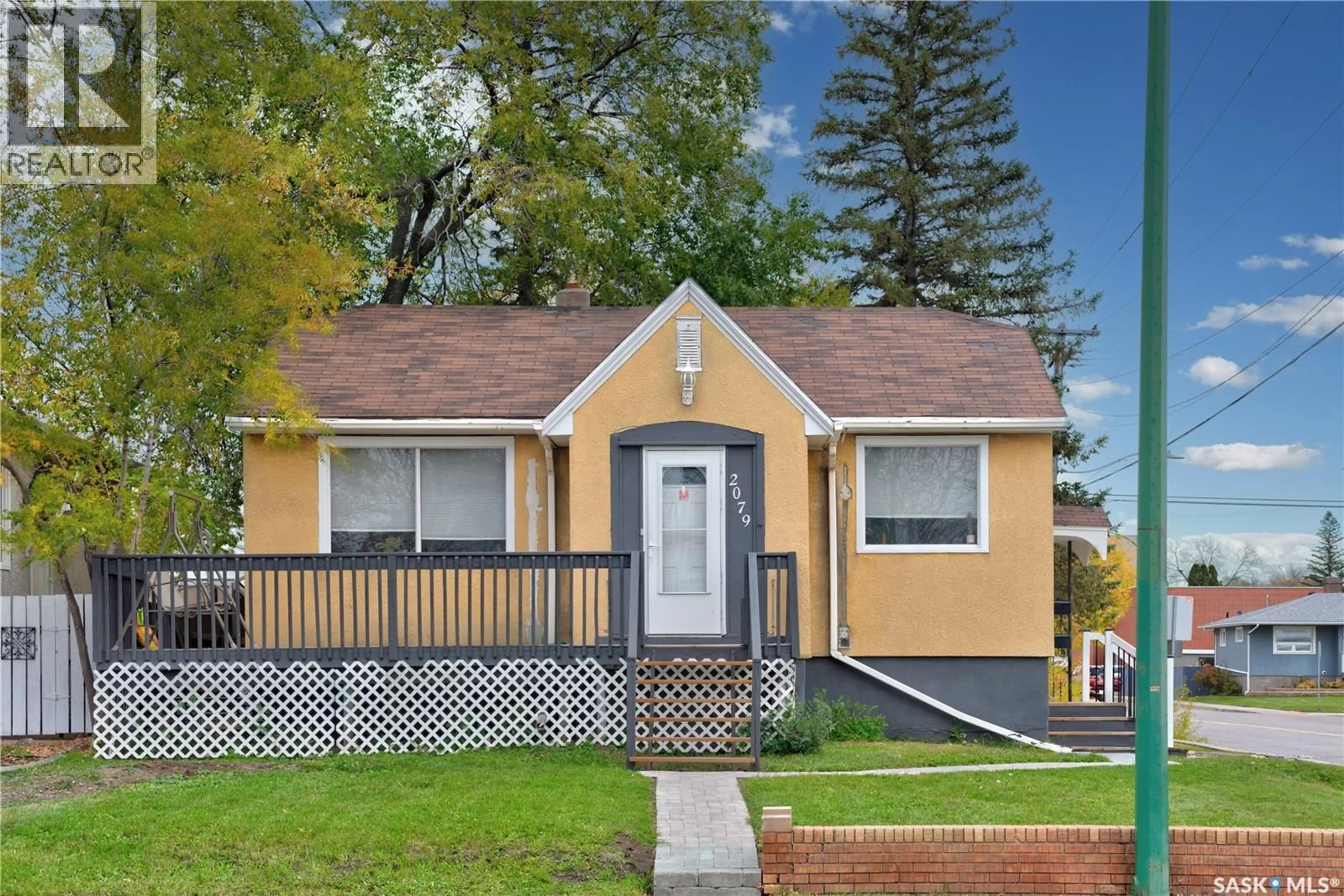 Home with vinyl exterior material, street for 2079 PASQUA STREET, Regina Saskatchewan S4T4M1