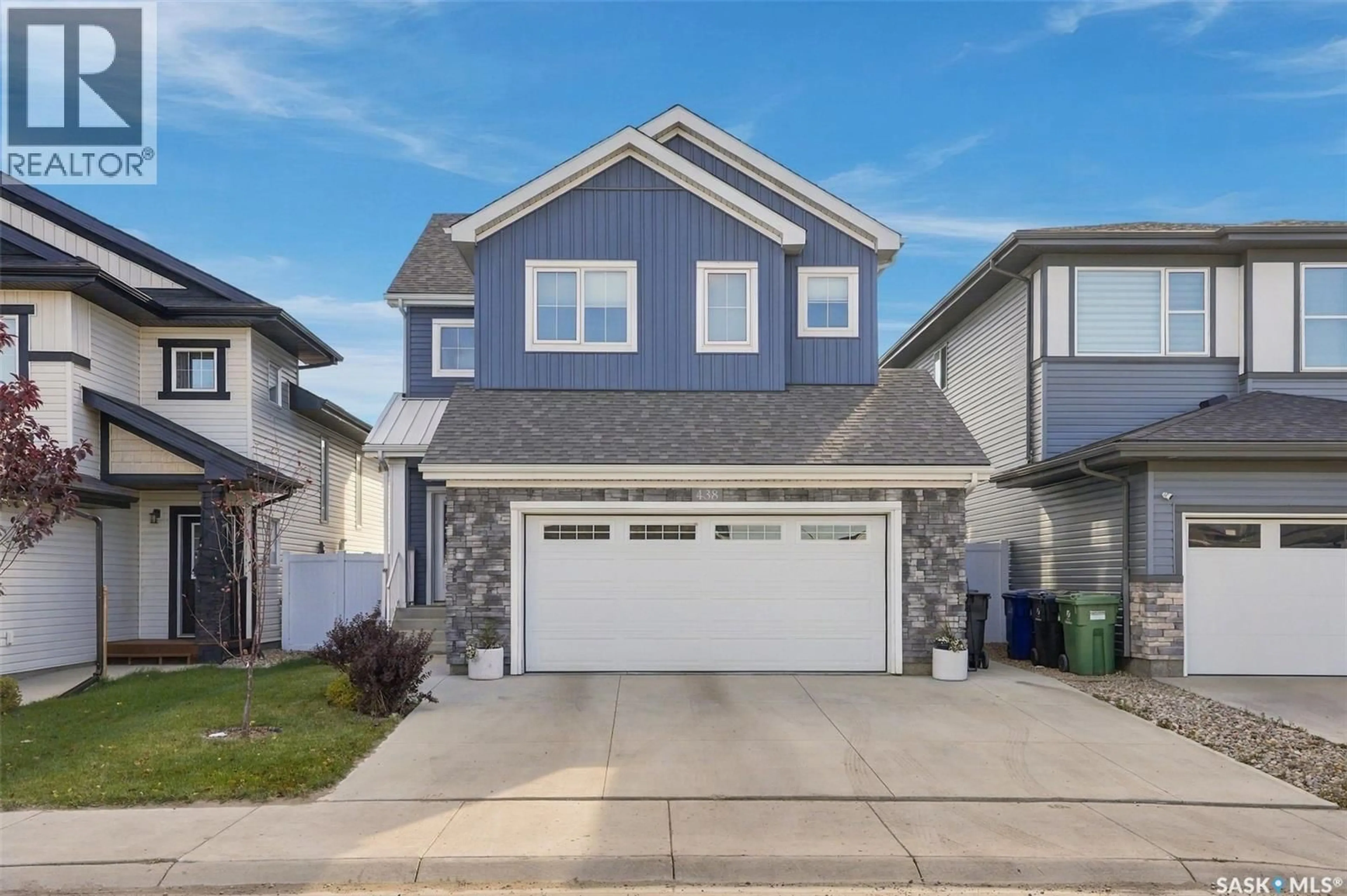 Home with vinyl exterior material, street for 438 ANISKOTAW WAY, Saskatoon Saskatchewan S7W1M3