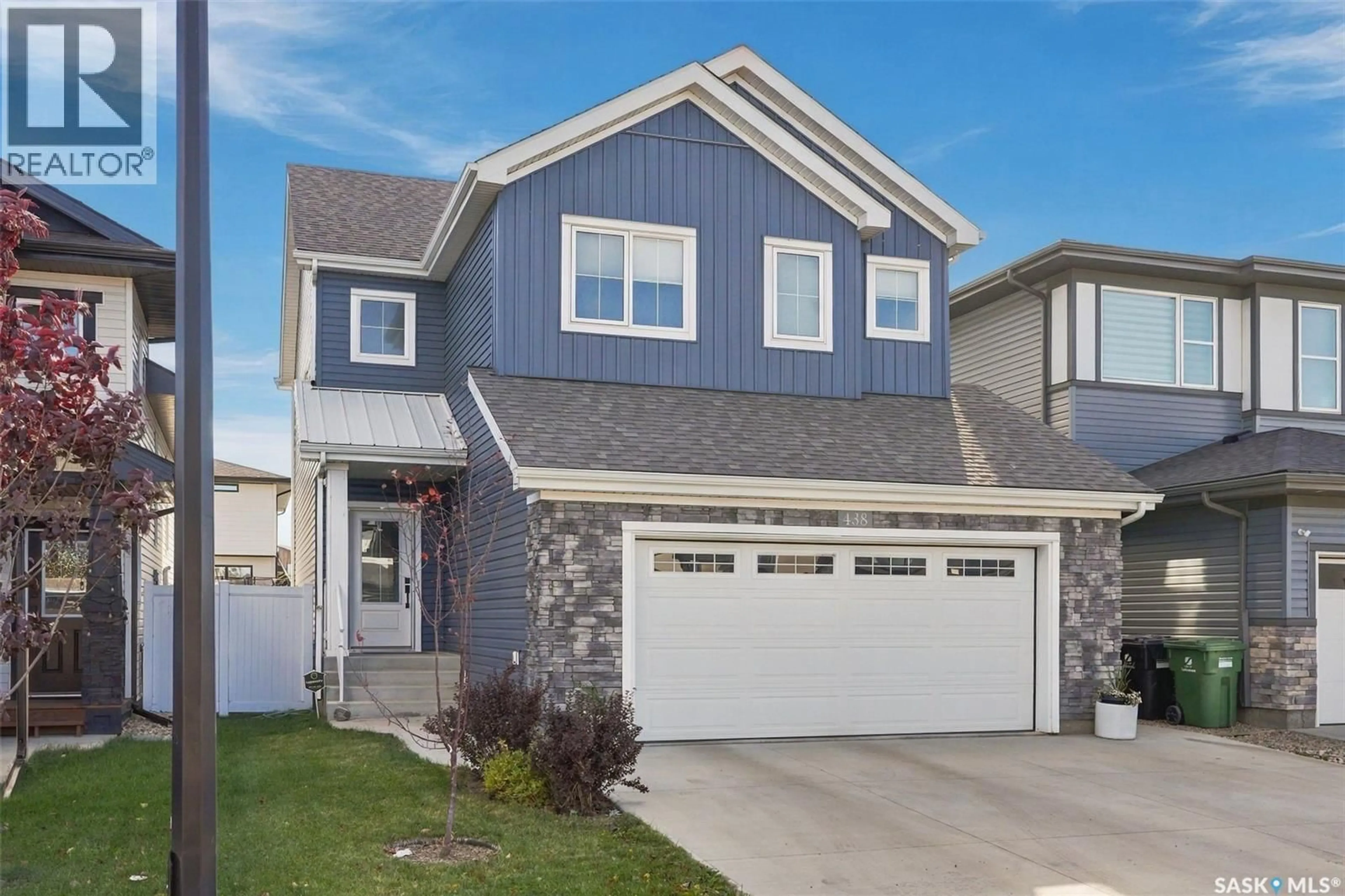 Home with vinyl exterior material, street for 438 ANISKOTAW WAY, Saskatoon Saskatchewan S7W1M3