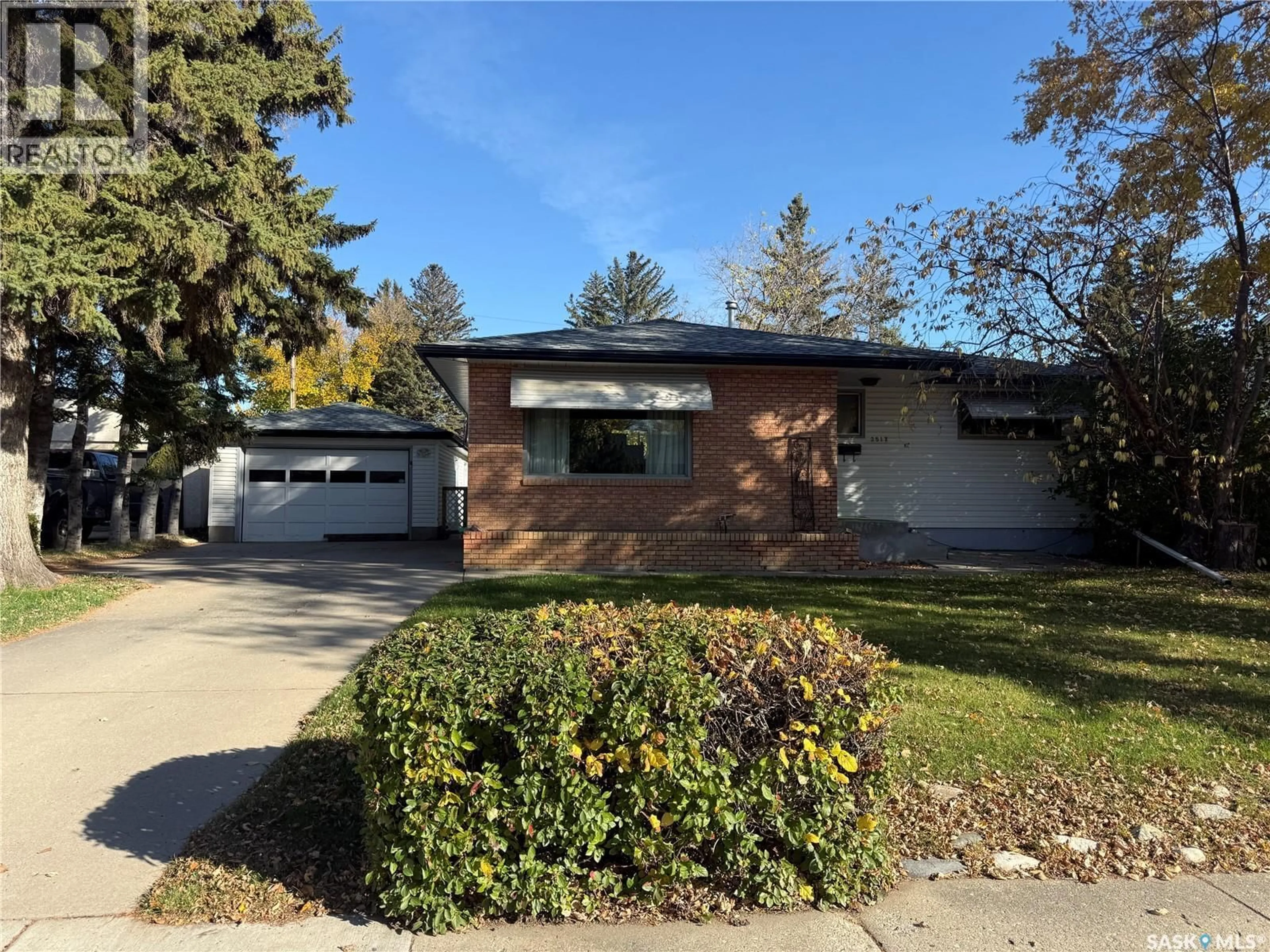 Home with vinyl exterior material, street for 2517 WIGGINS AVENUE, Saskatoon Saskatchewan S7J1X3