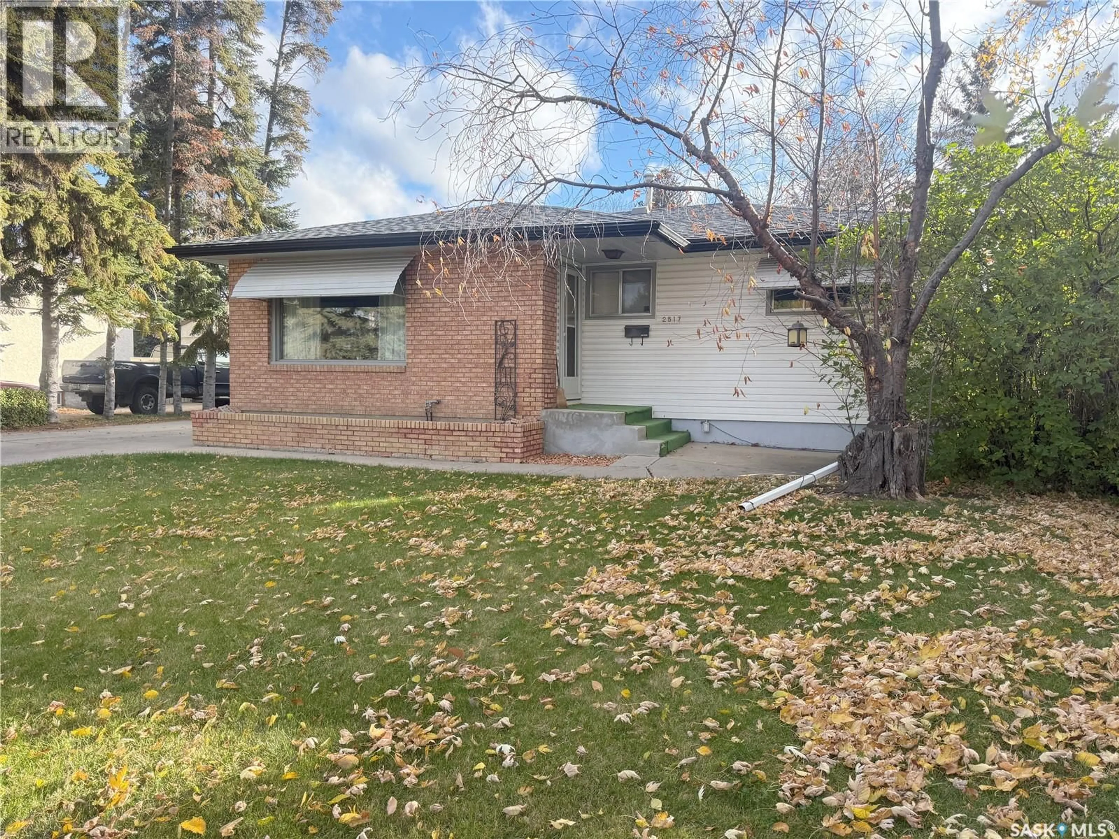 Home with brick exterior material, street for 2517 WIGGINS AVENUE, Saskatoon Saskatchewan S7J1X3