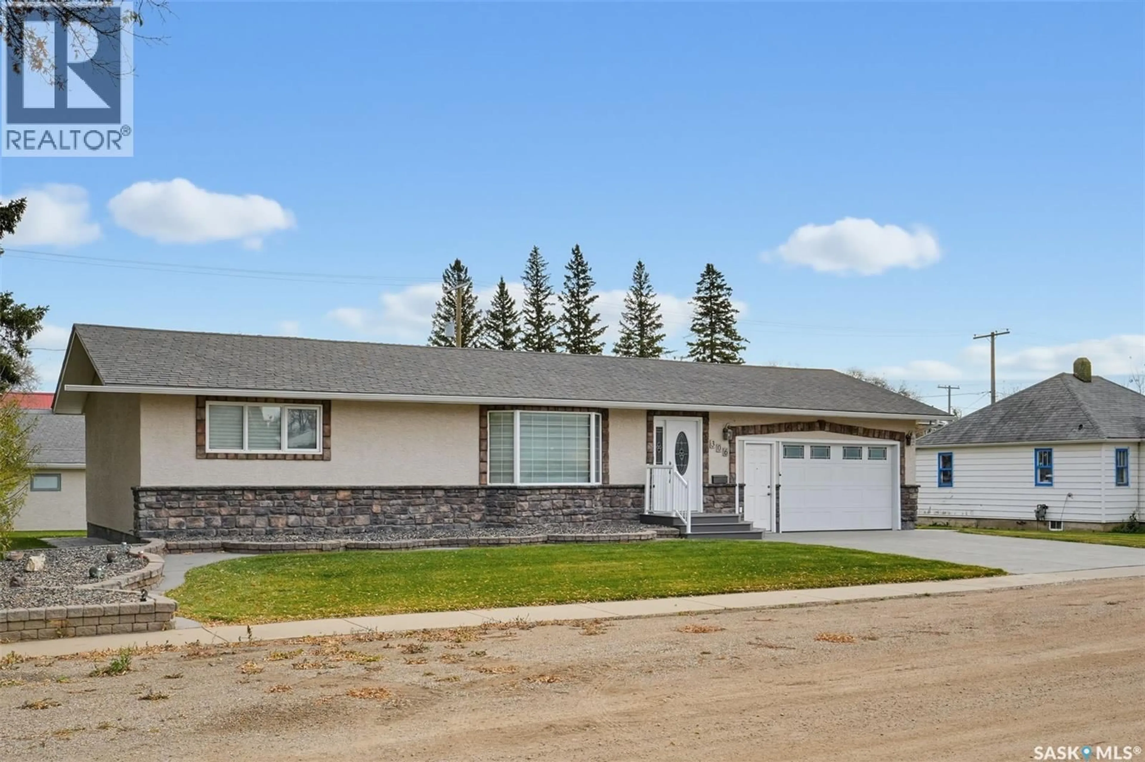 Home with vinyl exterior material, street for 306 3RD STREET, Vonda Saskatchewan S0K4N0