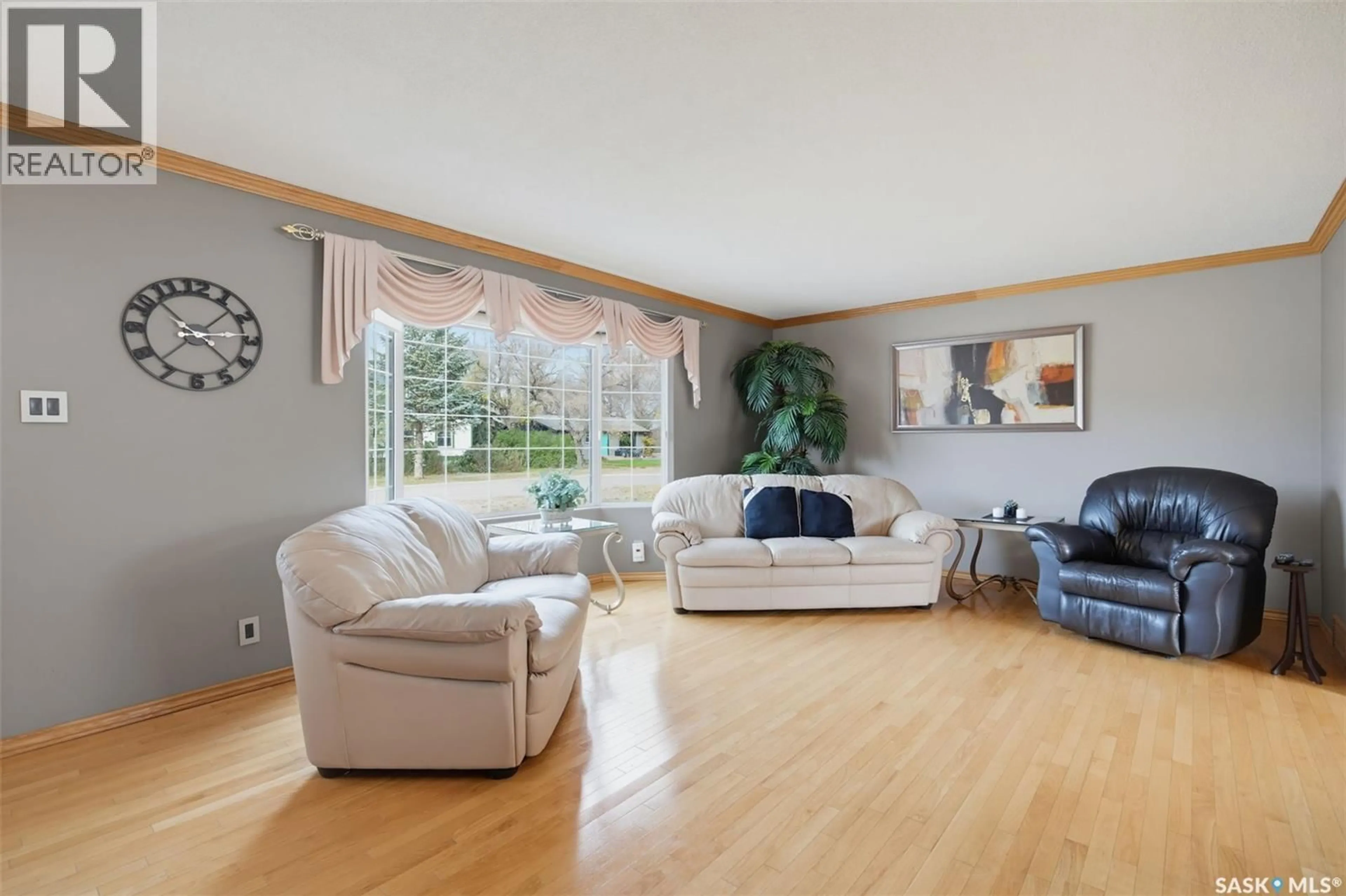 Living room with furniture, wood/laminate floor for 306 3RD STREET, Vonda Saskatchewan S0K4N0