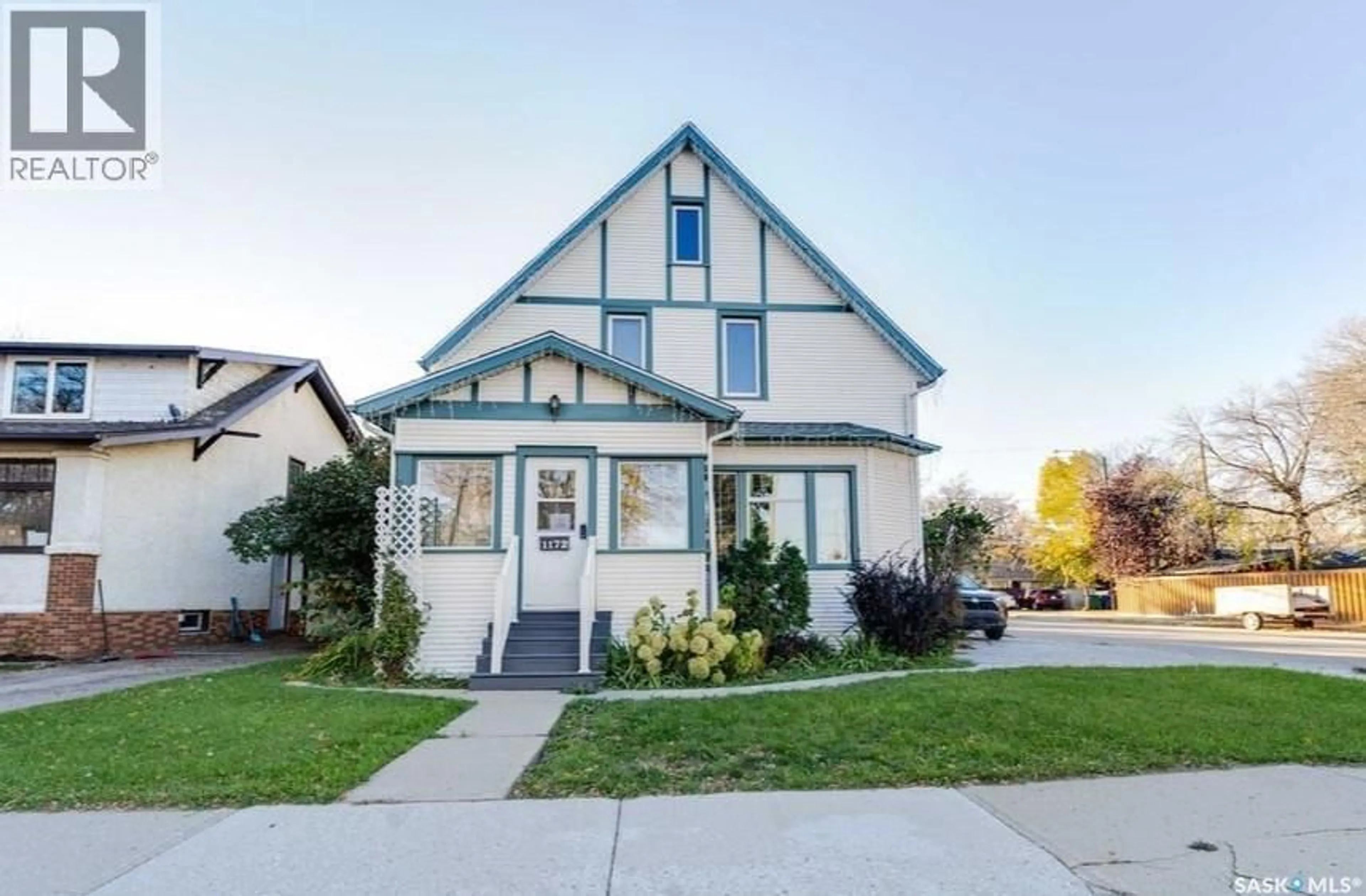 Home with vinyl exterior material, street for 1172 CLIFTON AVENUE, Moose Jaw Saskatchewan S6H3L5