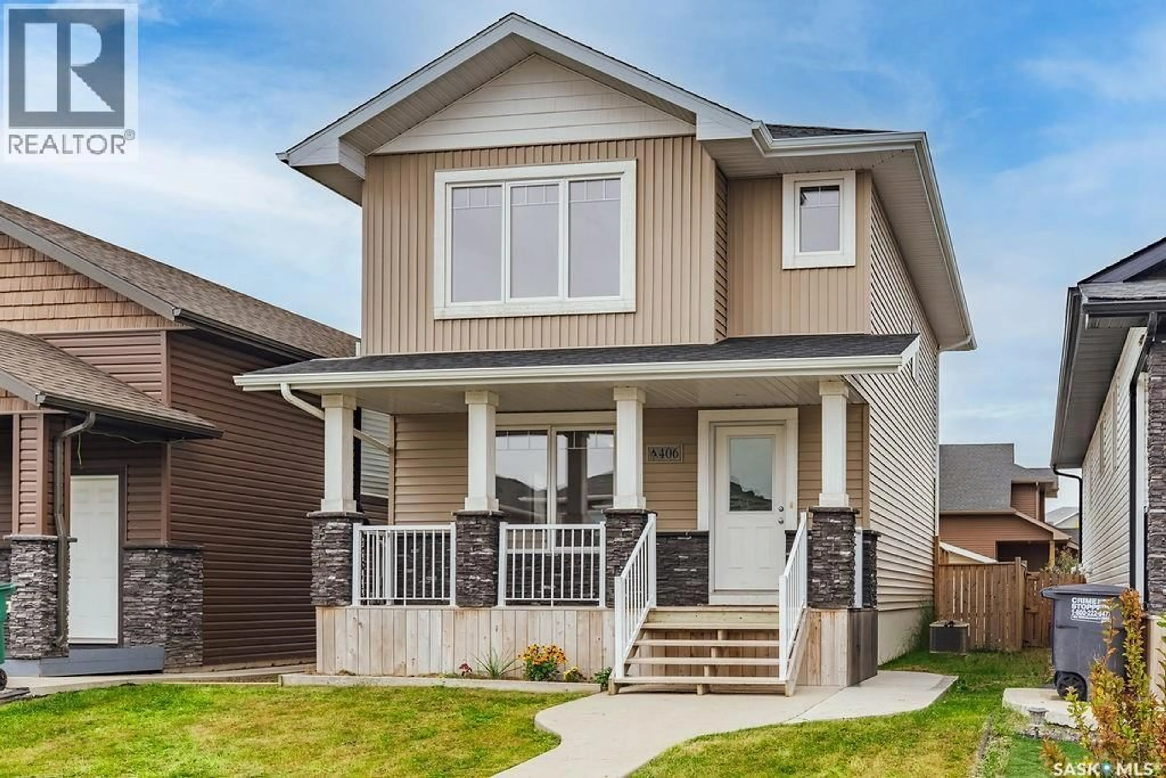 Home with vinyl exterior material, street for 406 BOYKOWICH STREET, Saskatoon Saskatchewan S7W0S4