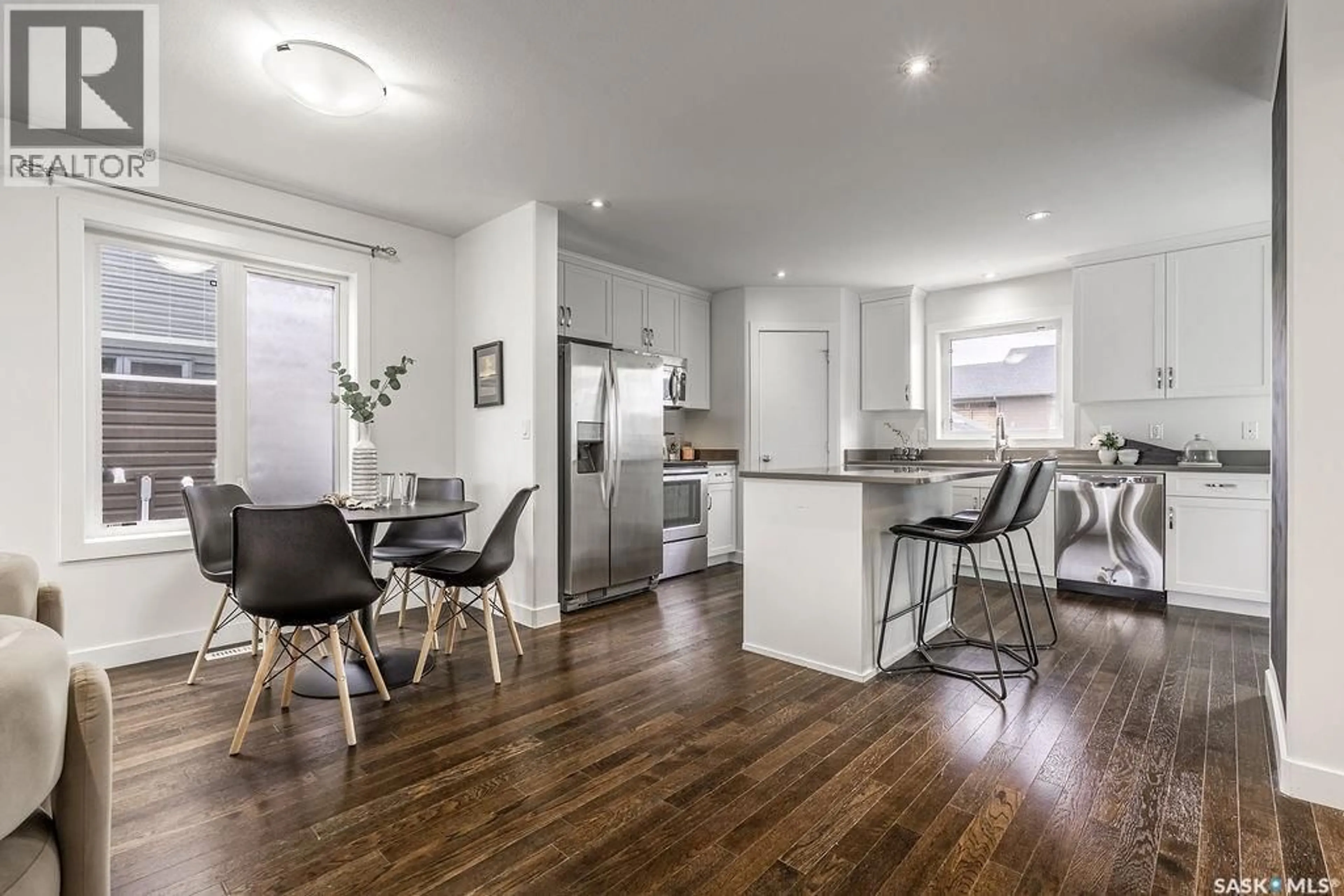 Open concept kitchen, wood/laminate floor for 406 BOYKOWICH STREET, Saskatoon Saskatchewan S7W0S4