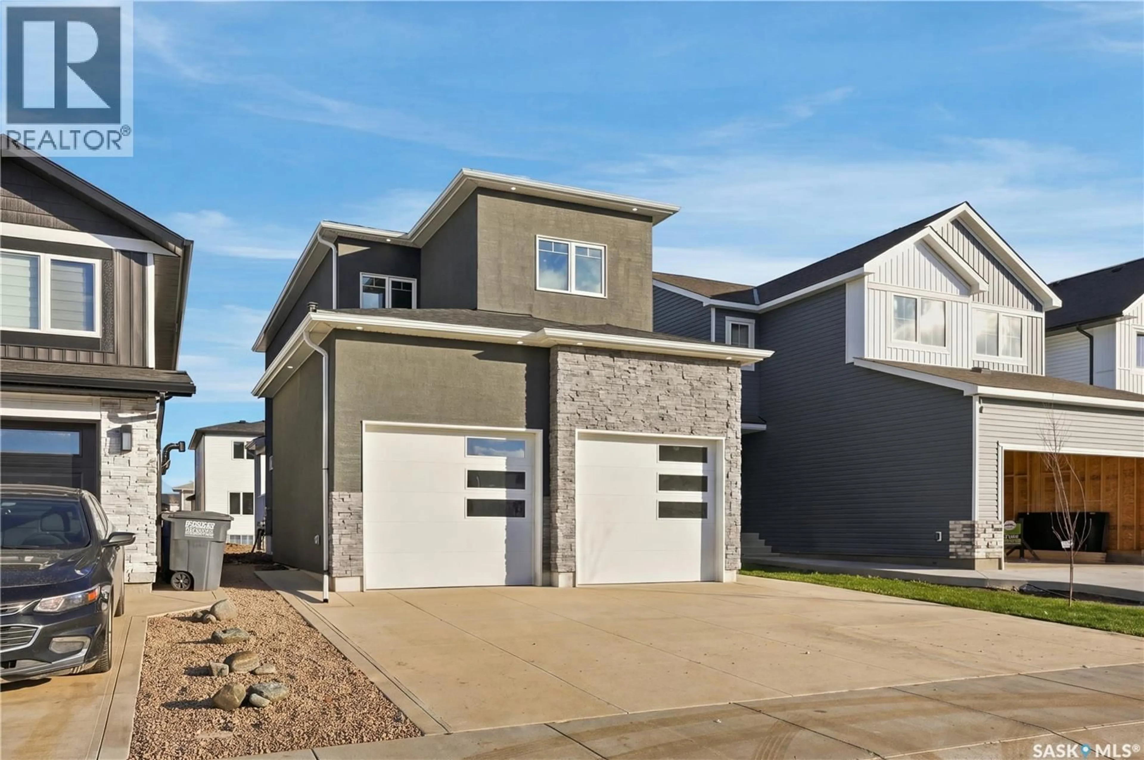 Home with vinyl exterior material, street for 714 NAZARALI UNION, Saskatoon Saskatchewan S7V1P1