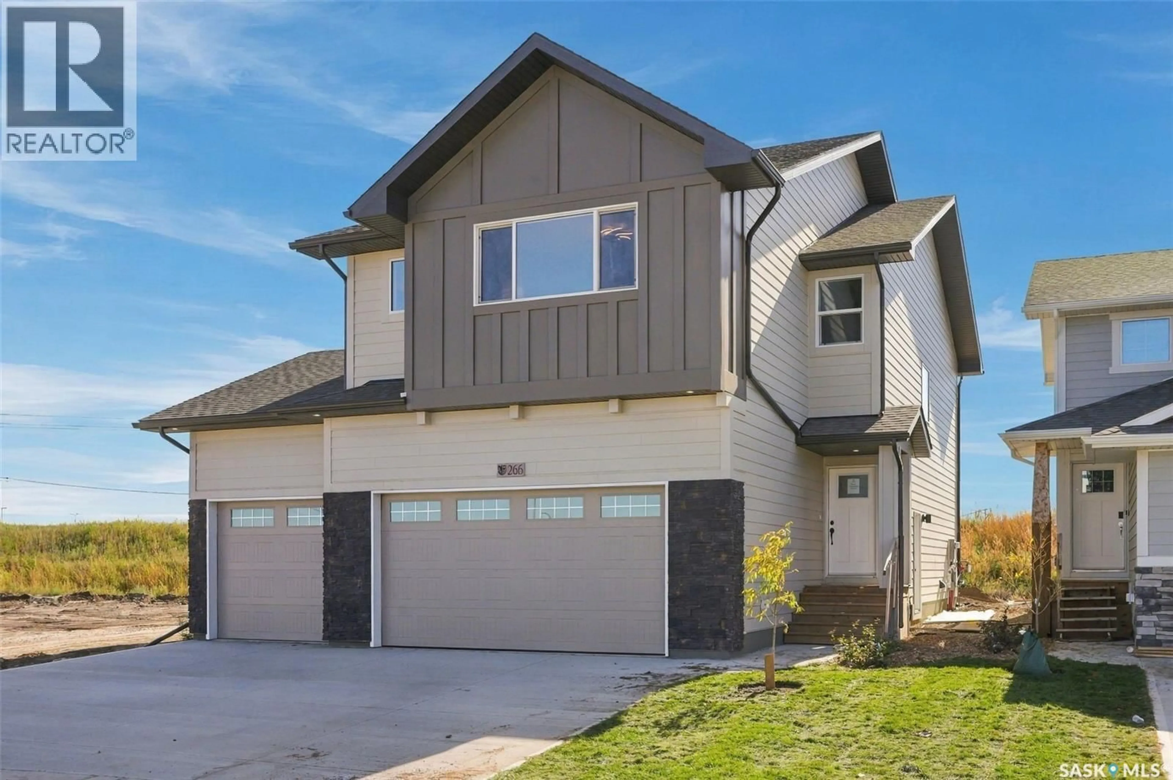 Home with vinyl exterior material, street for 266 KOSTIUK CRESCENT, Saskatoon Saskatchewan S7V2A3