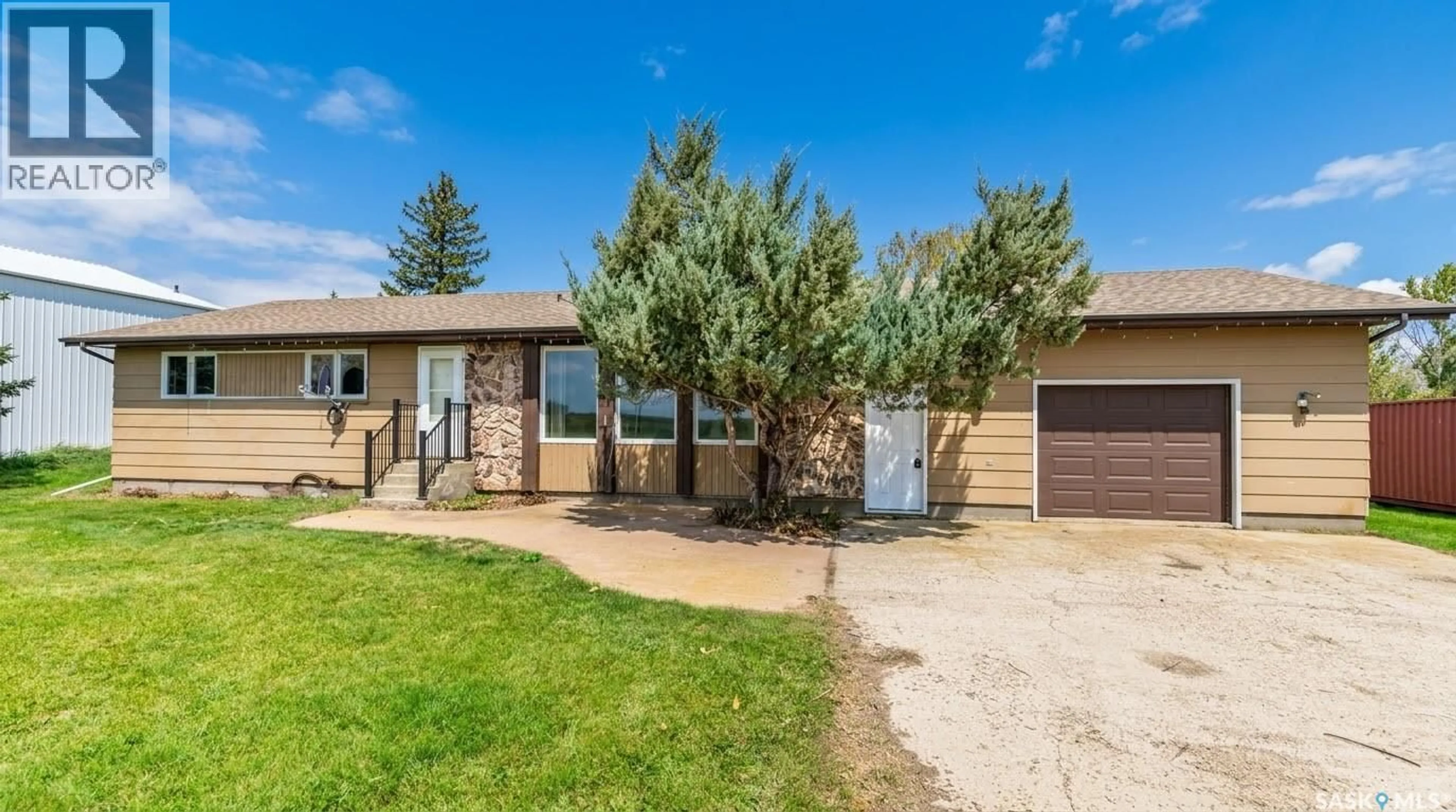 Home with vinyl exterior material, street for 1 CATHCART STREET, Brownlee Saskatchewan S0H0M0