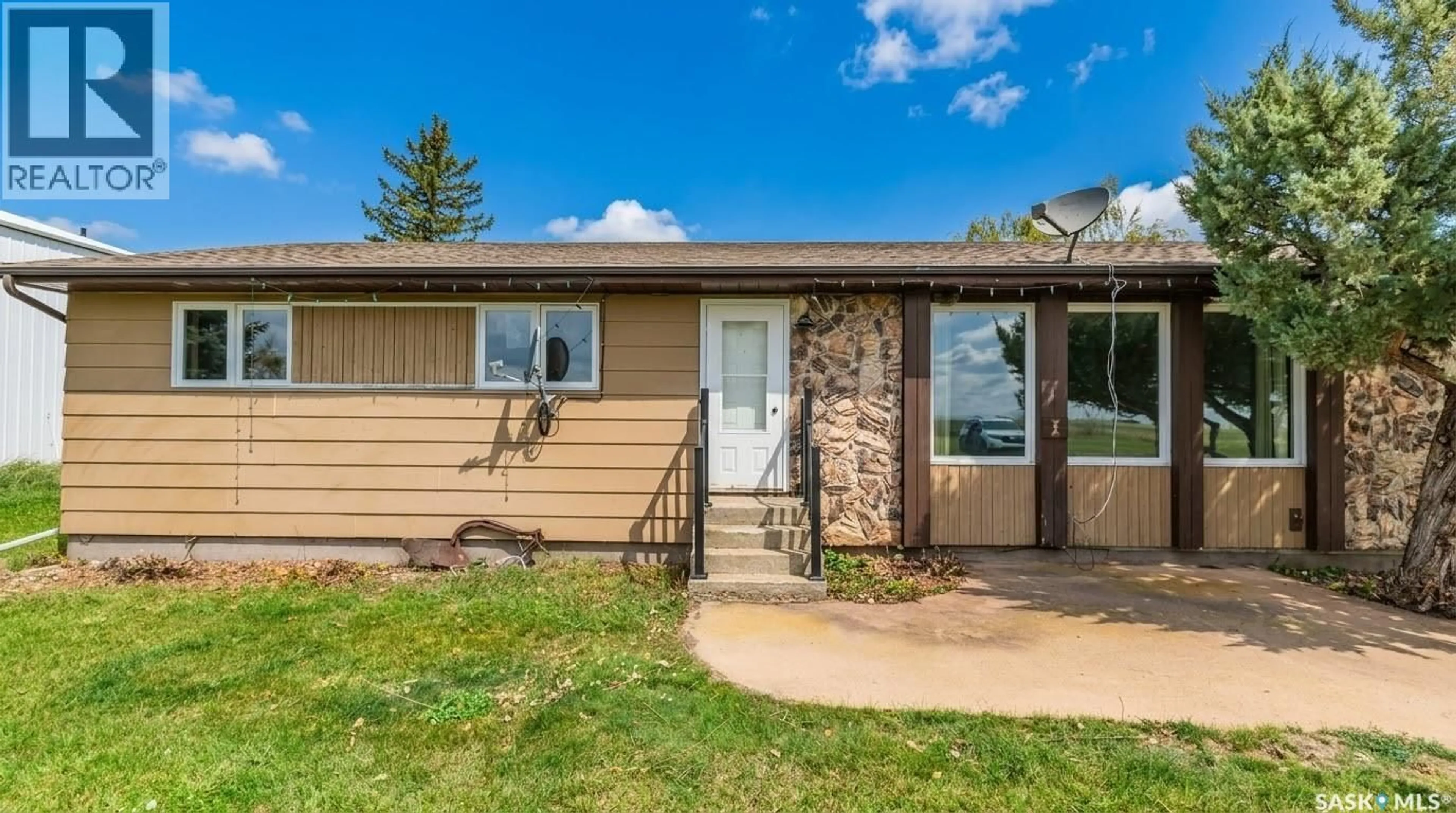 Home with vinyl exterior material, street for 1 CATHCART STREET, Brownlee Saskatchewan S0H0M0