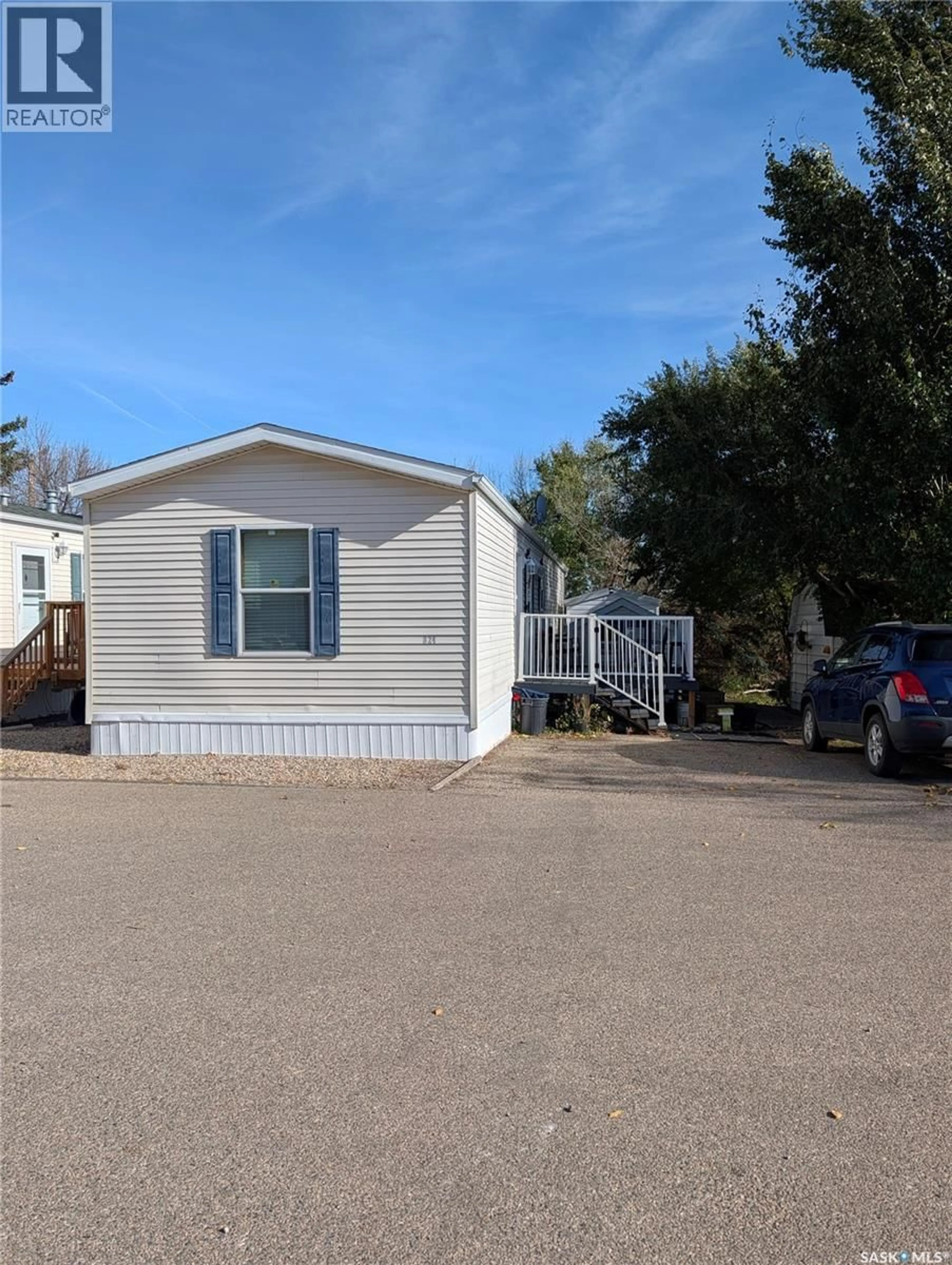 Home with vinyl exterior material, street for B24 - 1295 9TH AVENUE, Moose Jaw Saskatchewan S6J1C6