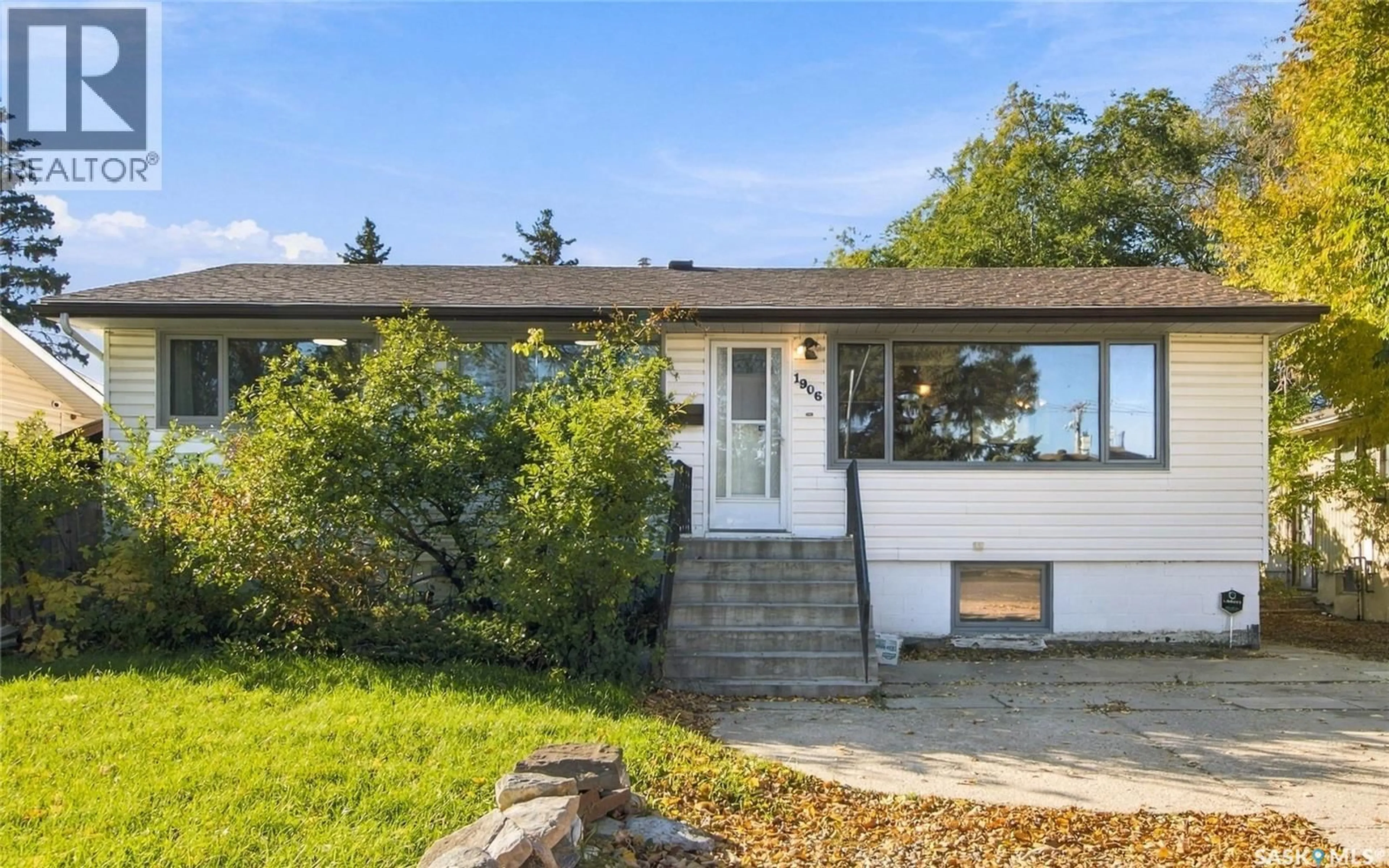 Home with vinyl exterior material, street for 1906 ST CHARLES AVENUE, Saskatoon Saskatchewan S7M0N8