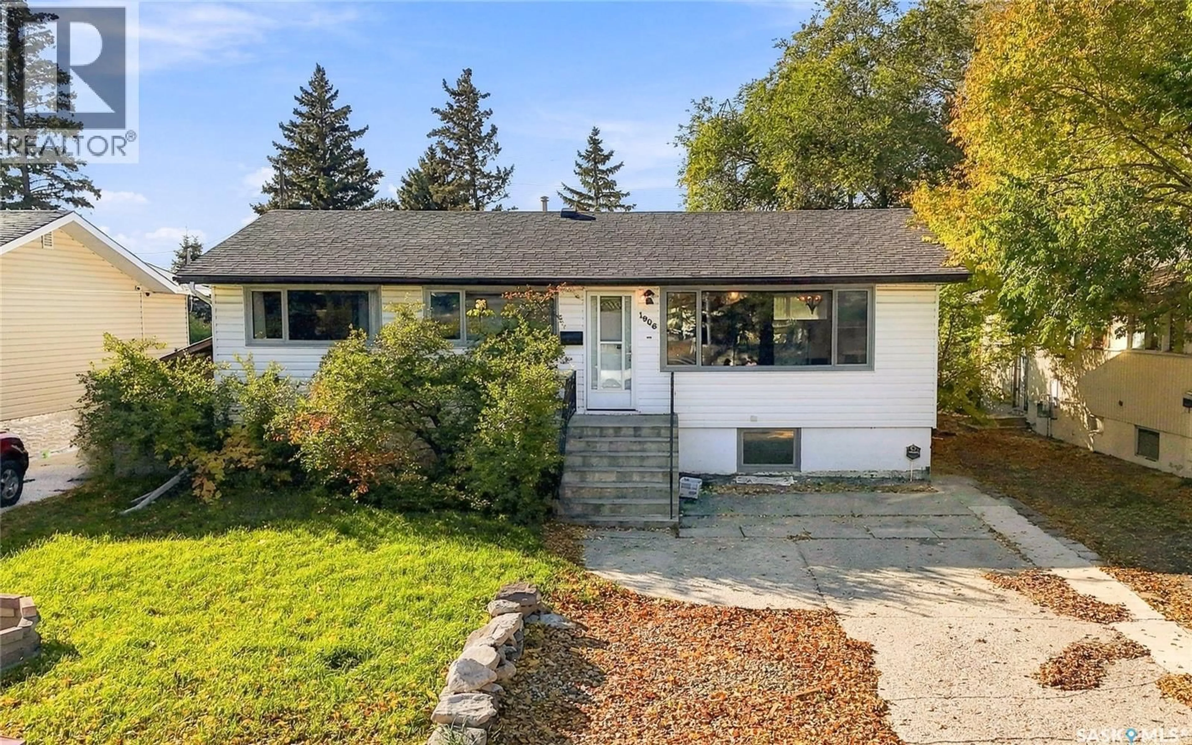 Home with vinyl exterior material, street for 1906 ST CHARLES AVENUE, Saskatoon Saskatchewan S7M0N8
