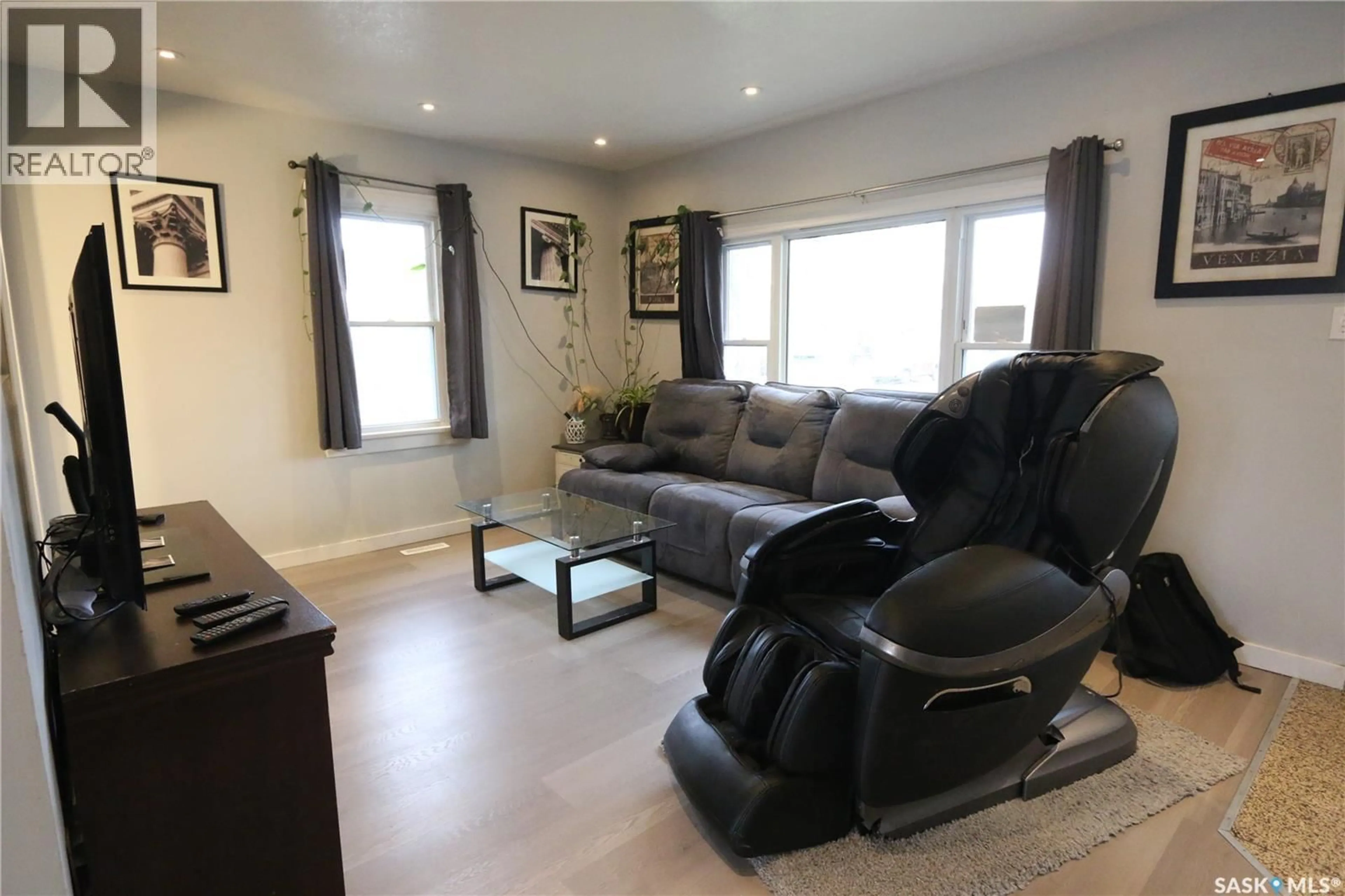 Living room with furniture, wood/laminate floor for 1000 WASCANA STREET, Regina Saskatchewan S4T4H7