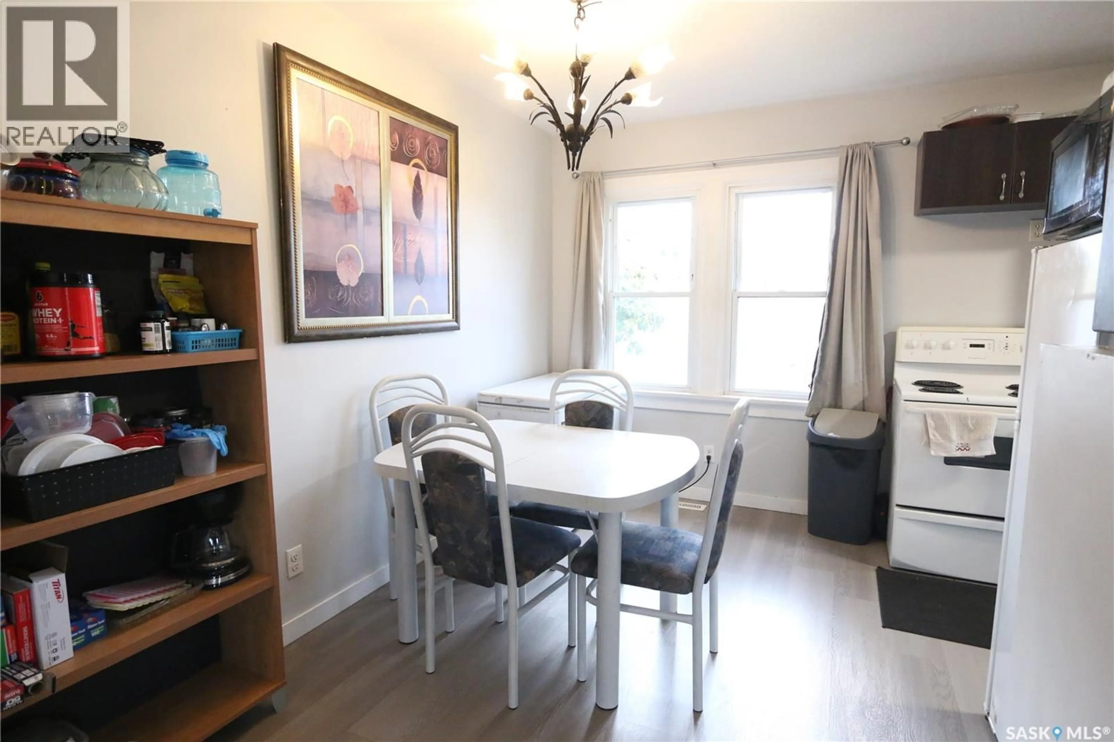 Dining room, wood/laminate floor for 1000 WASCANA STREET, Regina Saskatchewan S4T4H7