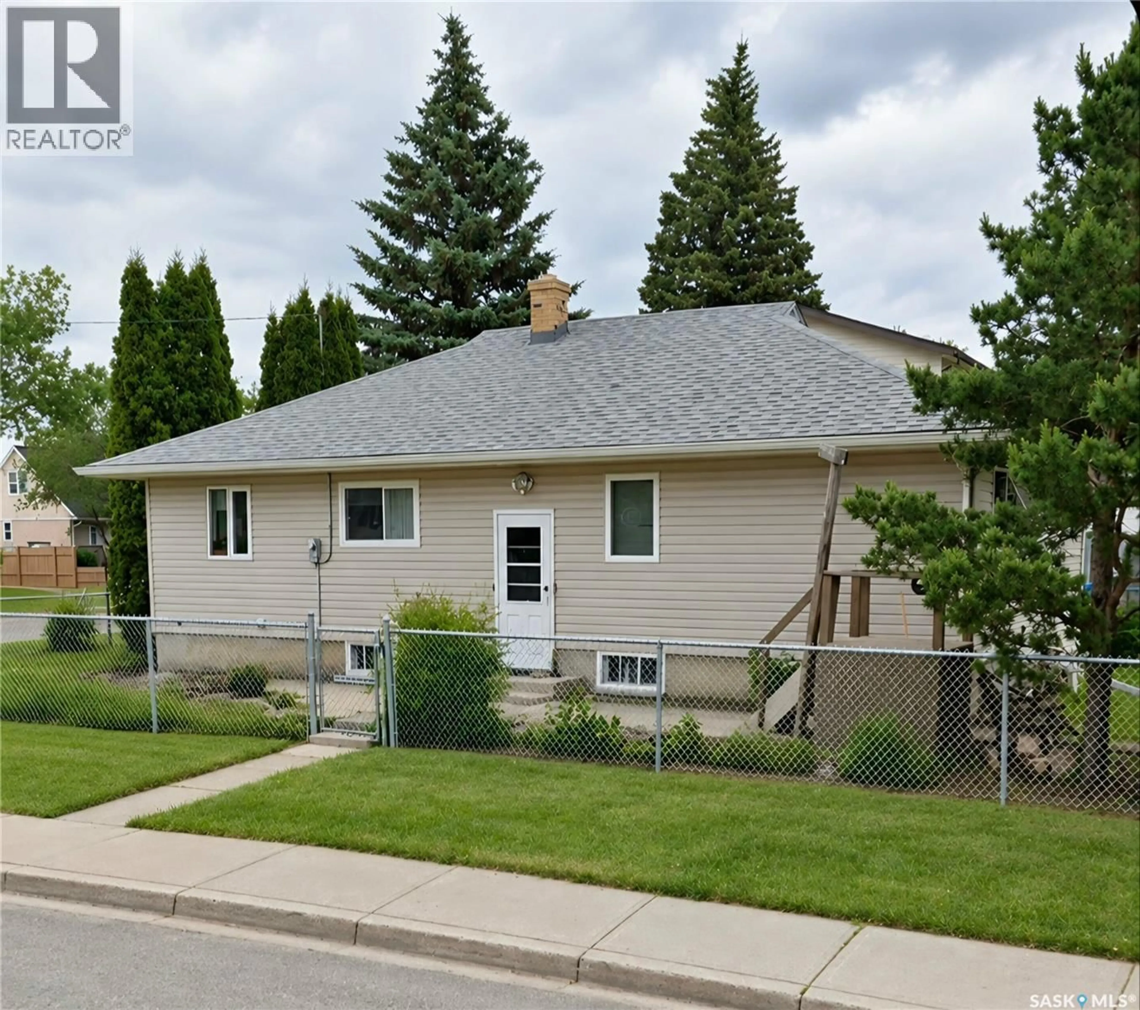 Home with vinyl exterior material, street for E - 805 4A STREET, Prince Albert Saskatchewan S6V0K6