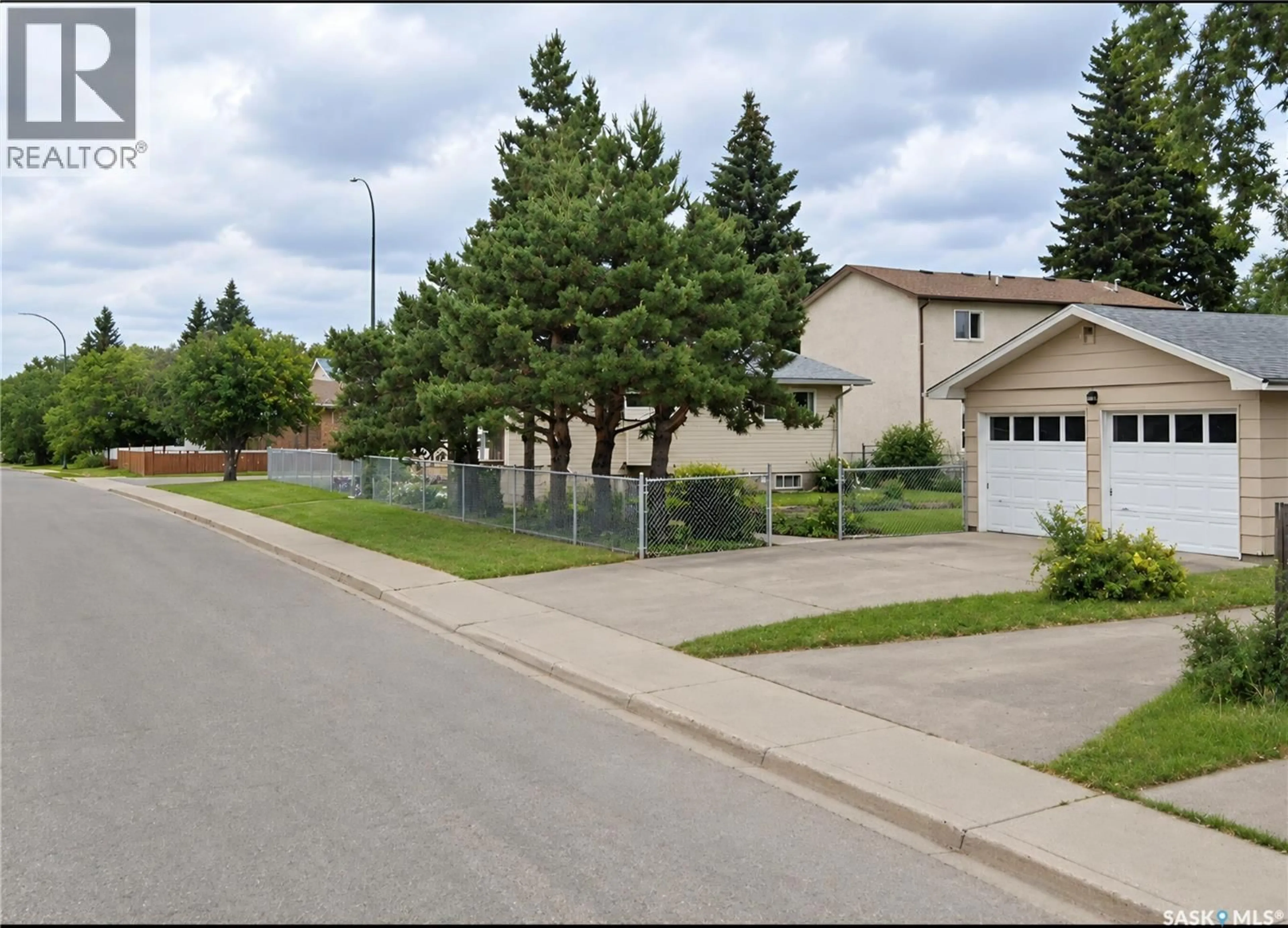 A pic from outside/outdoor area/front of a property/back of a property/a pic from drone, street for E - 805 4A STREET, Prince Albert Saskatchewan S6V0K6