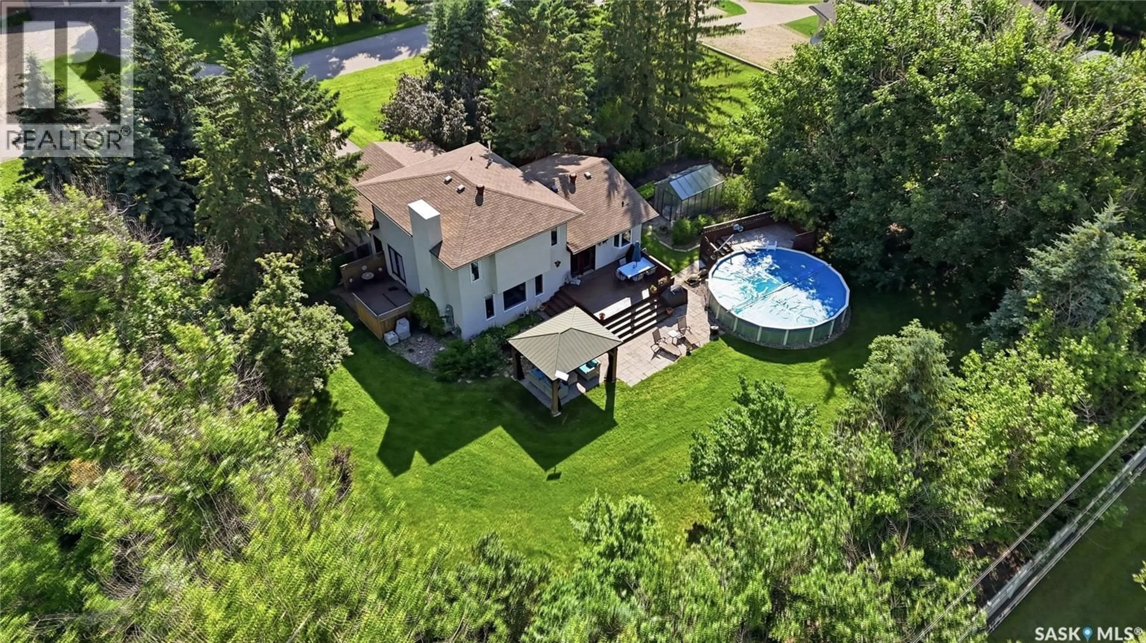 A pic from outside/outdoor area/front of a property/back of a property/a pic from drone, unknown for 65 MEADOW ROAD, White City Saskatchewan S4L5B1