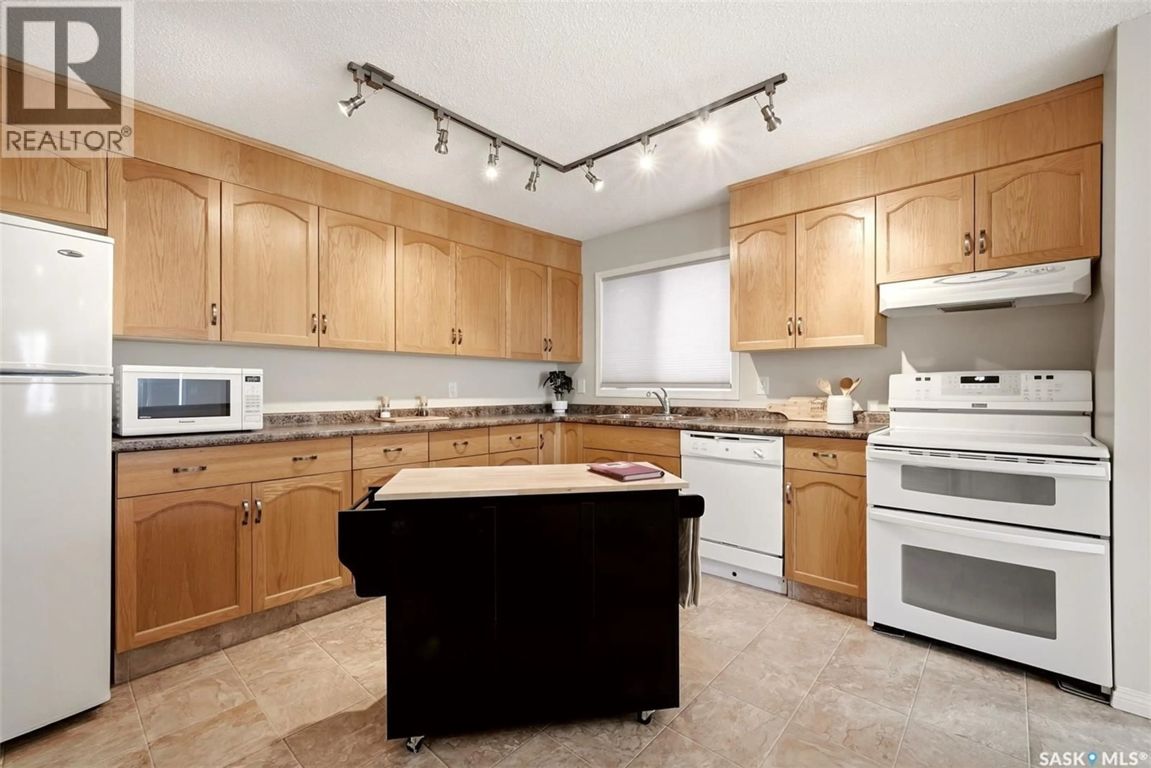 Standard kitchen, ceramic/tile floor for 309 - 2275 MCINTYRE STREET, Regina Saskatchewan S4P2S1