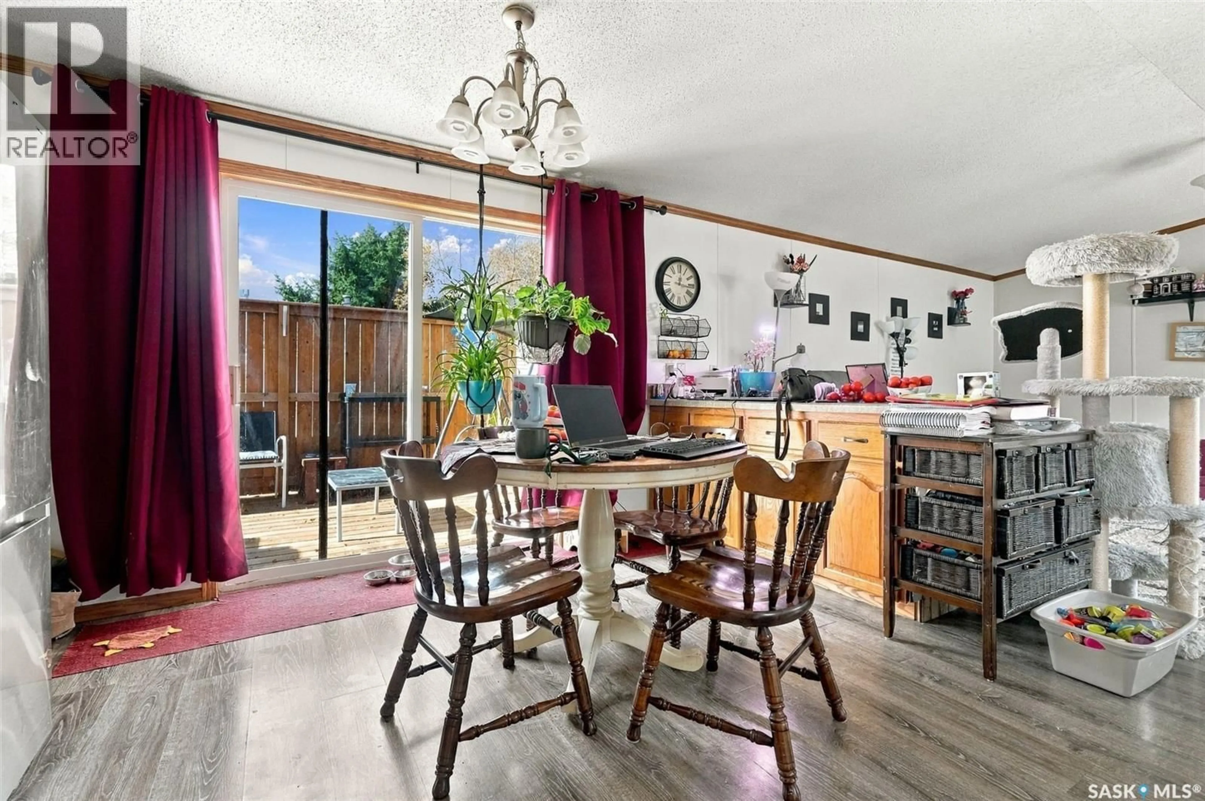 Dining room, wood/laminate floor for 305 5TH AVENUE, Caronport Saskatchewan S0H0S0