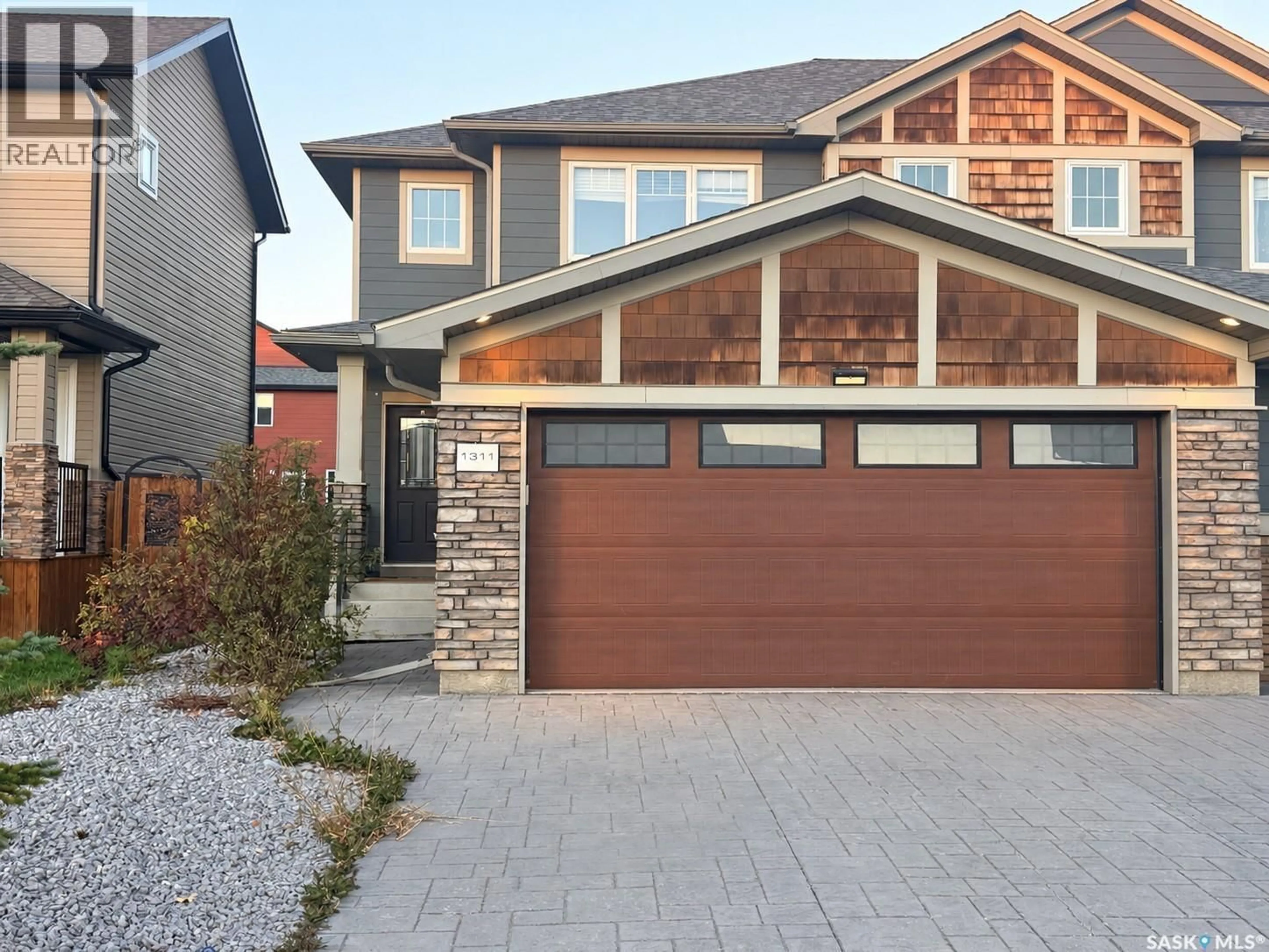 Home with brick exterior material, street for 1311 DENHAM CRESCENT, Saskatoon Saskatchewan S7R0B2
