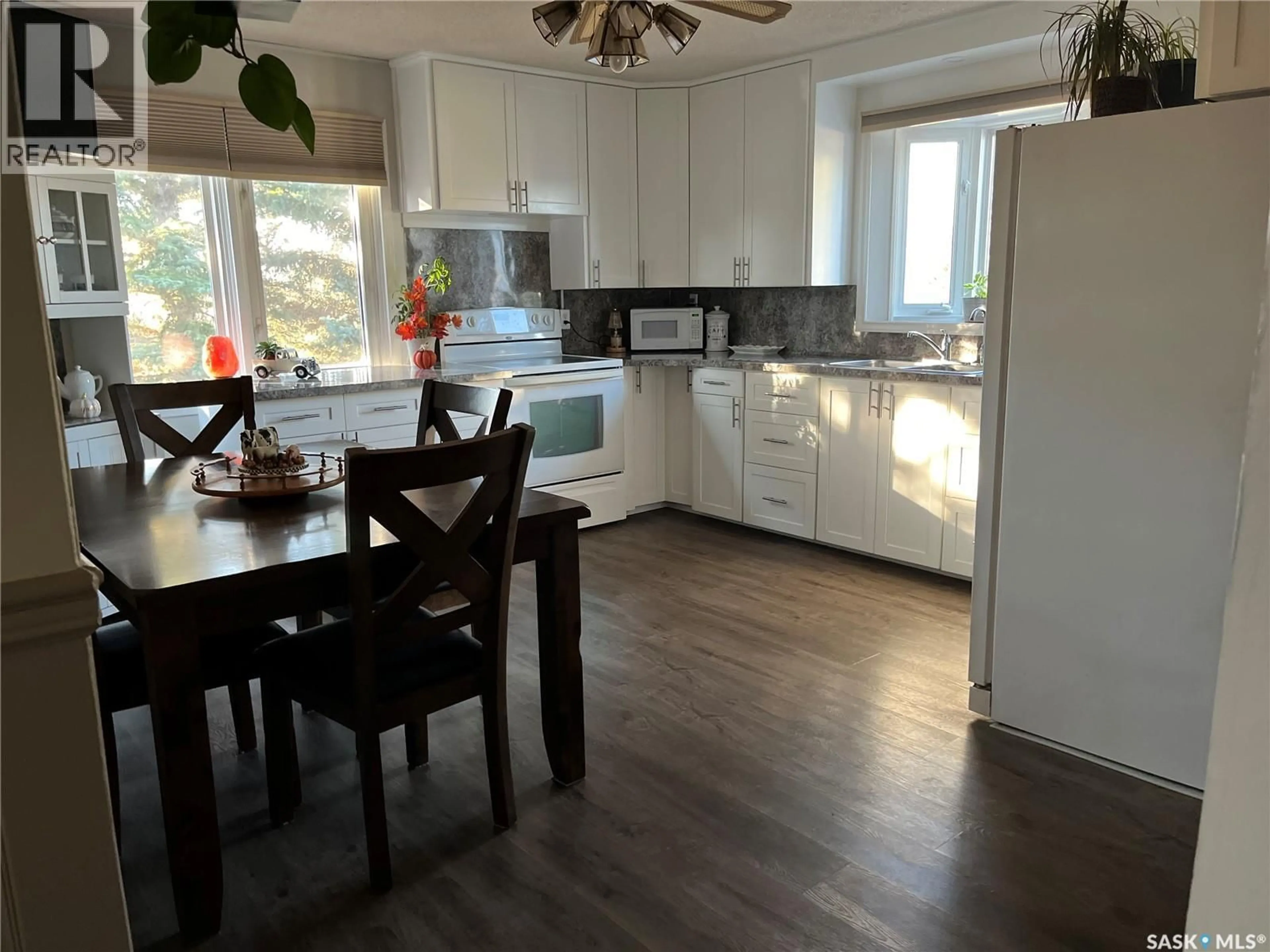 Open concept kitchen, wood/laminate floor for CATOR ACREAGE, Miry Creek Rm No. 229 Saskatchewan S0N0J0